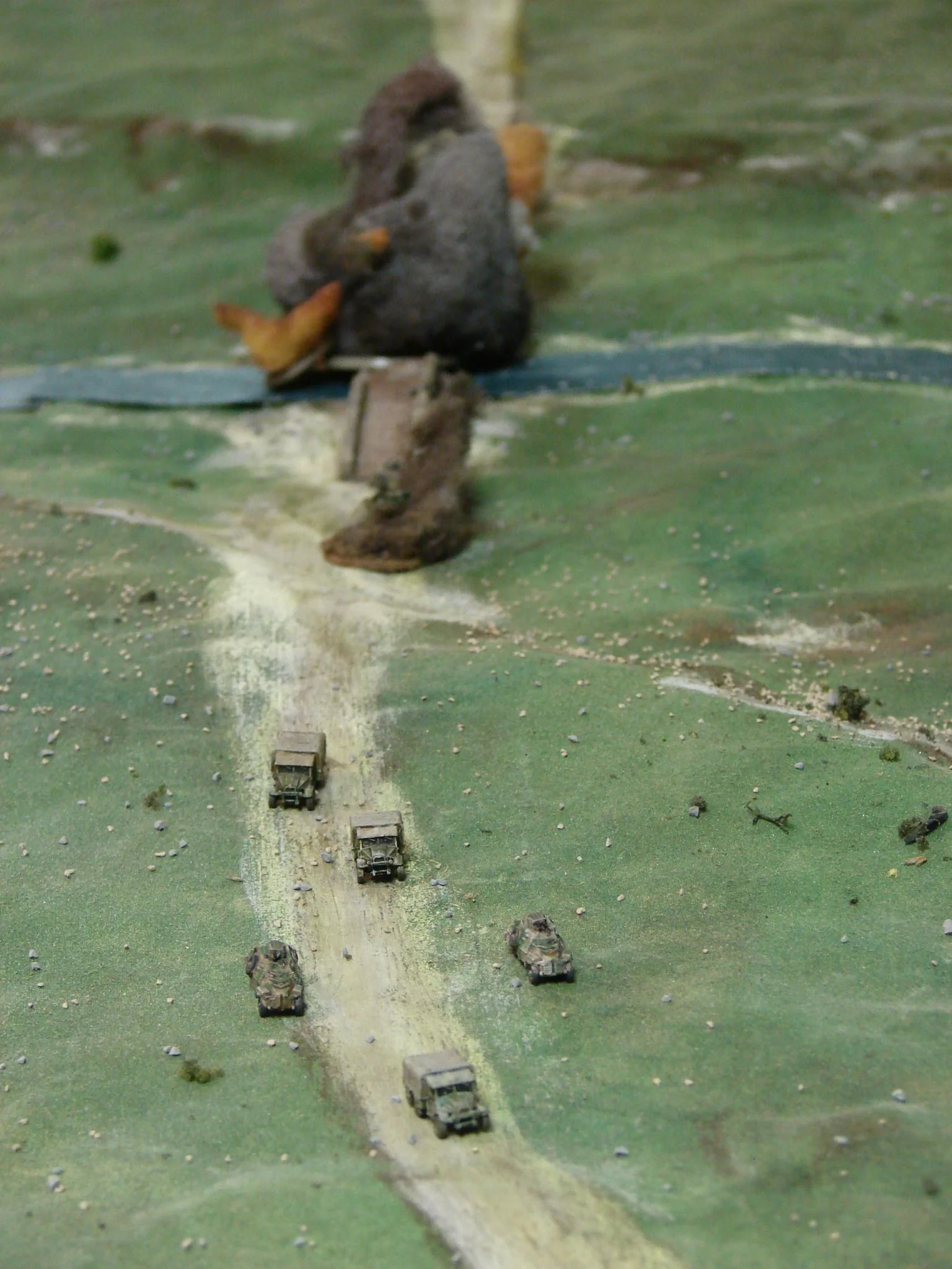 Heading South After picking up survivors the Brits and Kiwis will head to their next bridge having bought some time with this successful demolition. Overall Commonwealth casualties were one armoured car, one truck, and 13 engineers. The Germans lost 18 troops, six motorcycles, and one truck in the action. They also lost one of the Sdkfz 221s when it ran into a ditched bike. Now the table gets turned around and slightly altered for the second half of the game.
