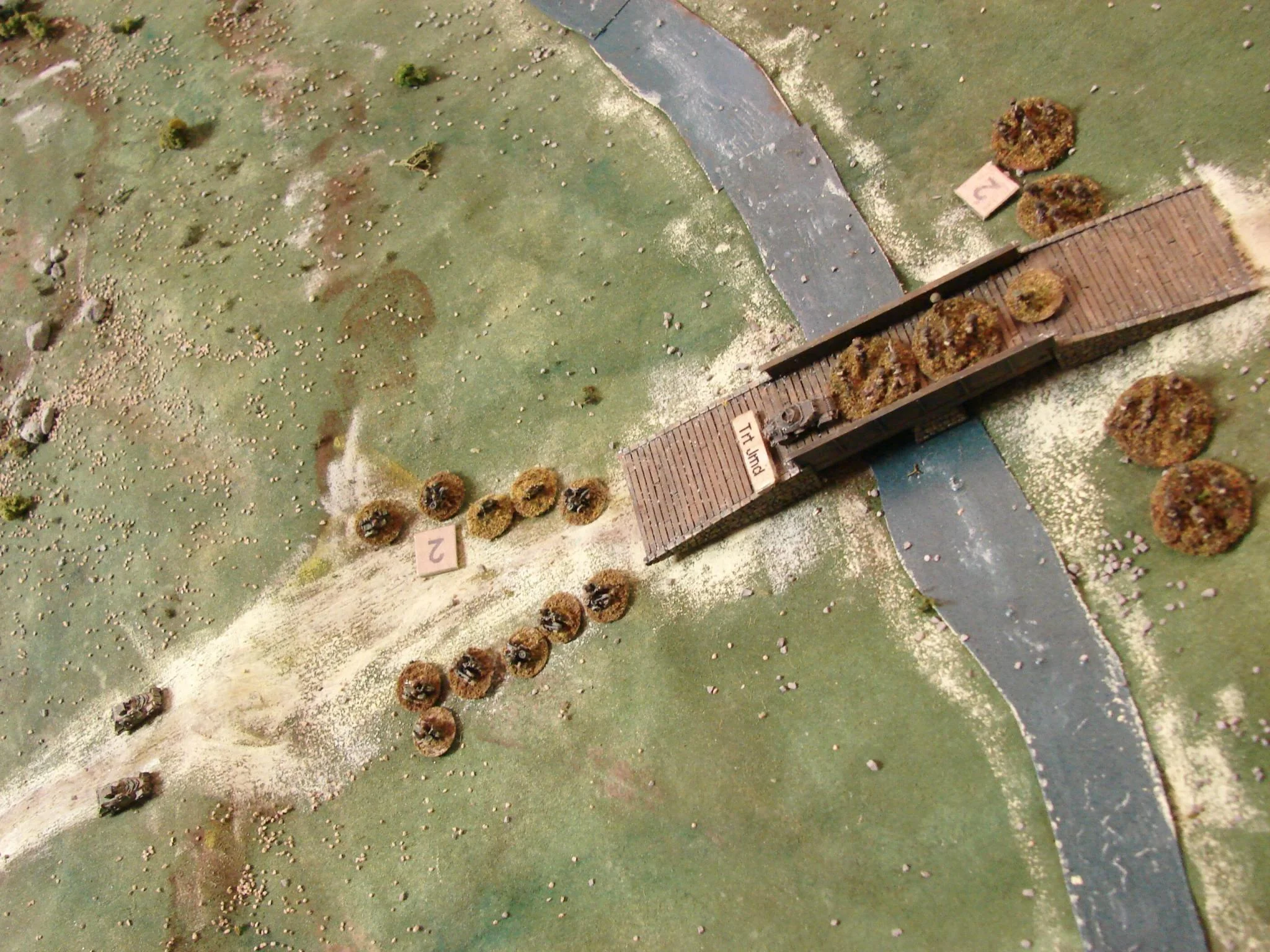 Didn't quite make it Fire for the deployed sections around the bridge managed to stop the charging motorcycle troops. But the armoured car continues onto the bridge with the hope of getting across to the other side. At the very least, this will disrupt Captain Page and the section working on the bridge.
