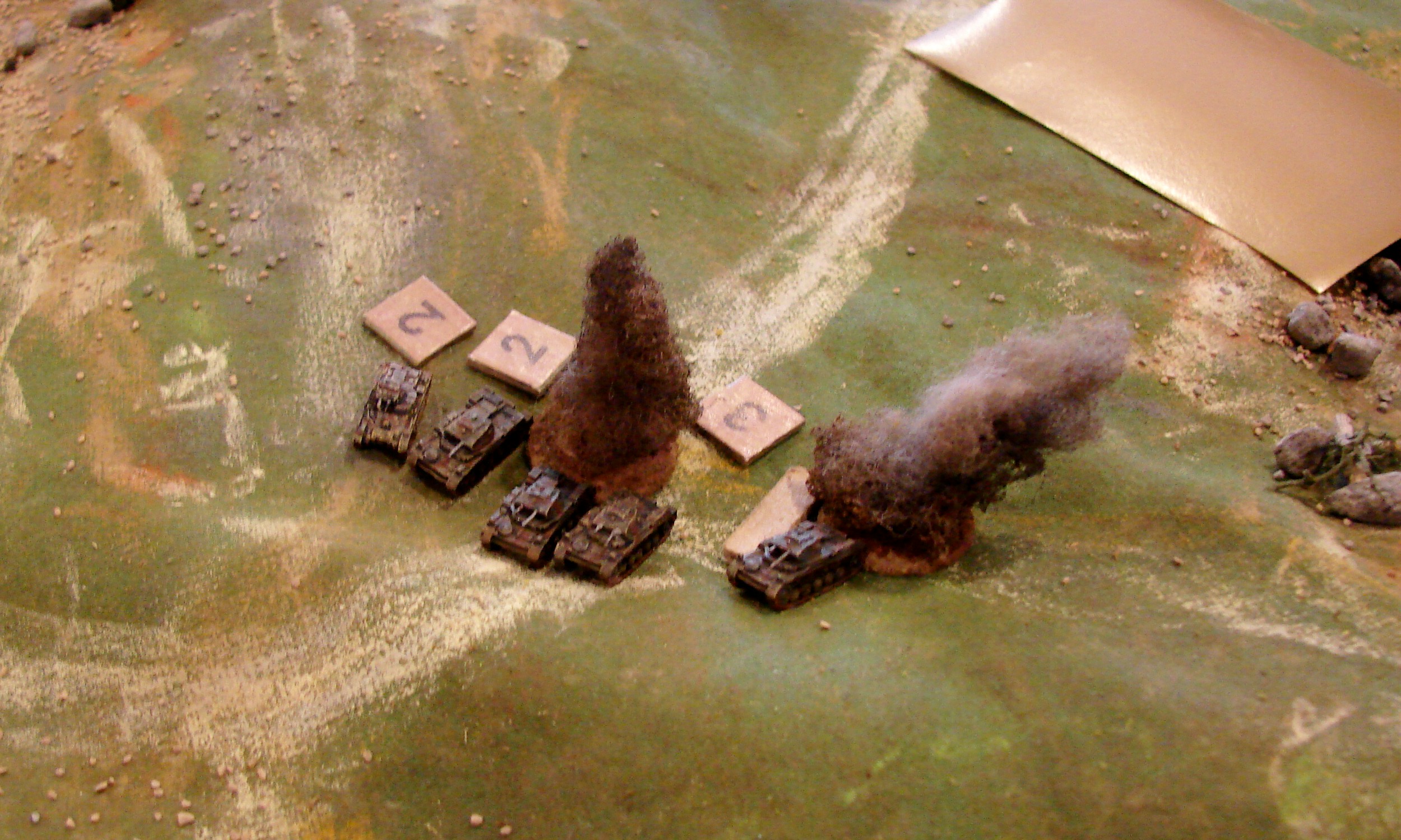Sympathetic Damage The Brits managed to KO two of the Pz IIs and when the middle one exploded, it caused shock to the other panzers. Lesson here is to keep some space between your tanks. The German commander: And here is why you never ever bunch up your tanks. The British commander: Luckiest shot of the game ... or so I thought.