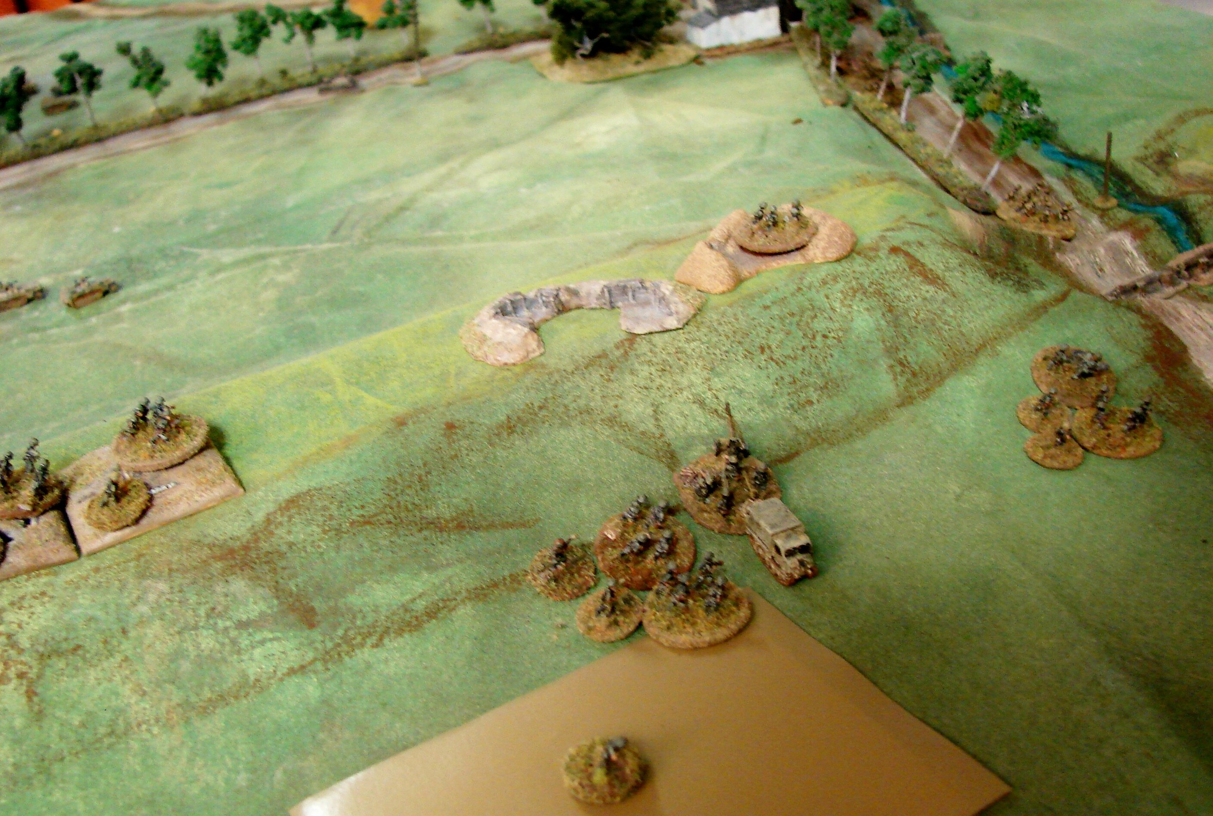 Changing of the guard The other Pak and MMG team looks like it got up the first dike just in time-maybe. Dennis really needs to win the Close Combat or the Soviets can prevent the Pak from getting up the dike into position. One infantry section remains up on the dike to put fire down on the front.