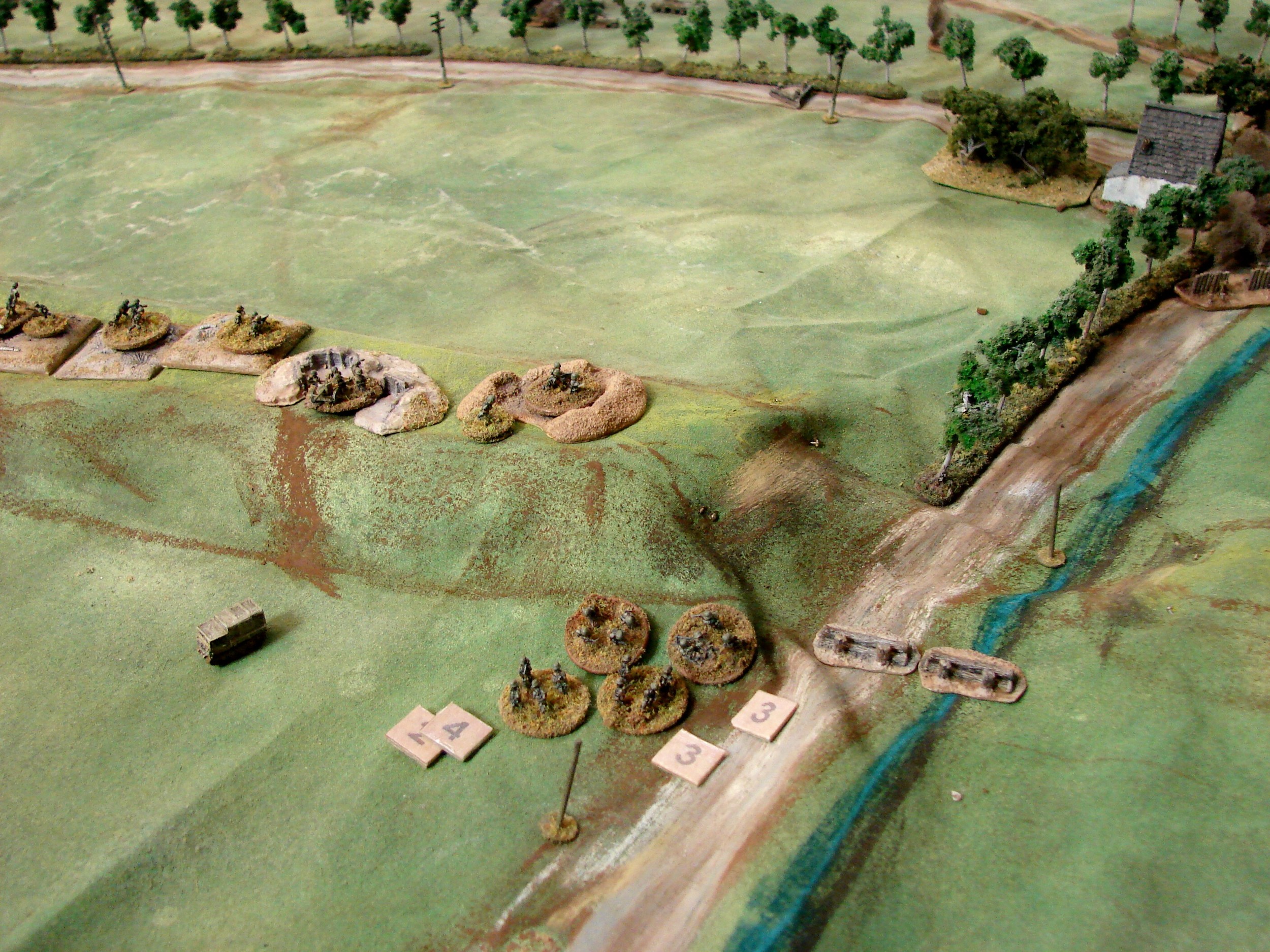 Grenadiers run back After using all their panzerfausts (in vain), the surviving grenadiers dash back to the dyke. Meanwhile the second Pak & MMG have moved (slowly) up to positions on the dyke. This was where we stopped the first night. Dennis had done a good job of bottling up the Russkies.