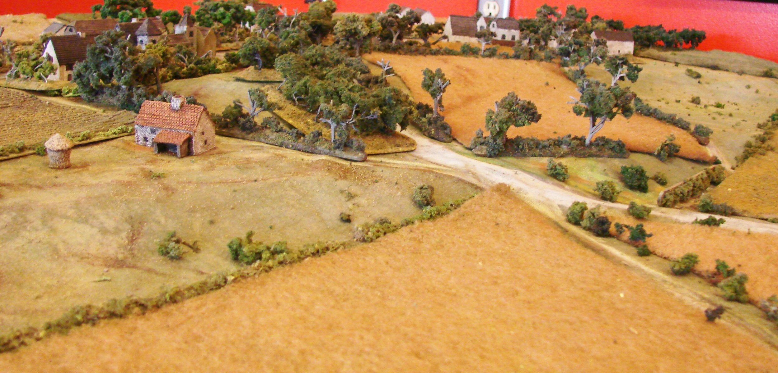 Normandy farmland I like setting up Normandy games because the table always looks interesting. Lots of small farms, hedges, orchards, fields.This farmhouse was in a great spot to cover the left flank of the Germans so I set up a Pak 38 in its yard. The rest of the remnants of the 5 Kompanie, II Battalion, Regiment 352 are off to its right.