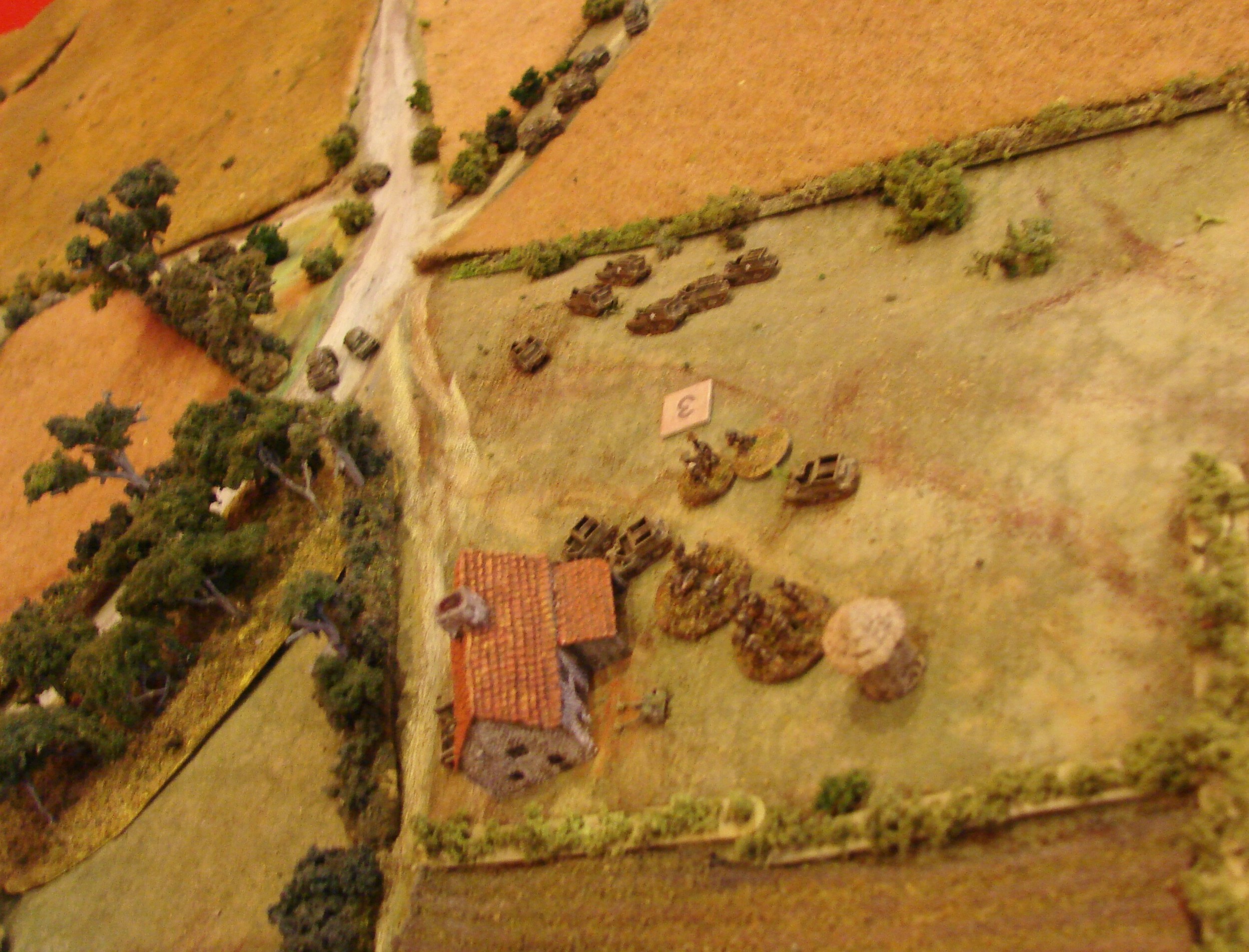7 and 8 Troops plotting their next moves Or at least what is left of them. They've lost an LRC and Big Man from 8 Troop and most of that troop's carriers sections are stuck back by their entry road taking casualties. 7 Troop did lose a man taking the Pak.