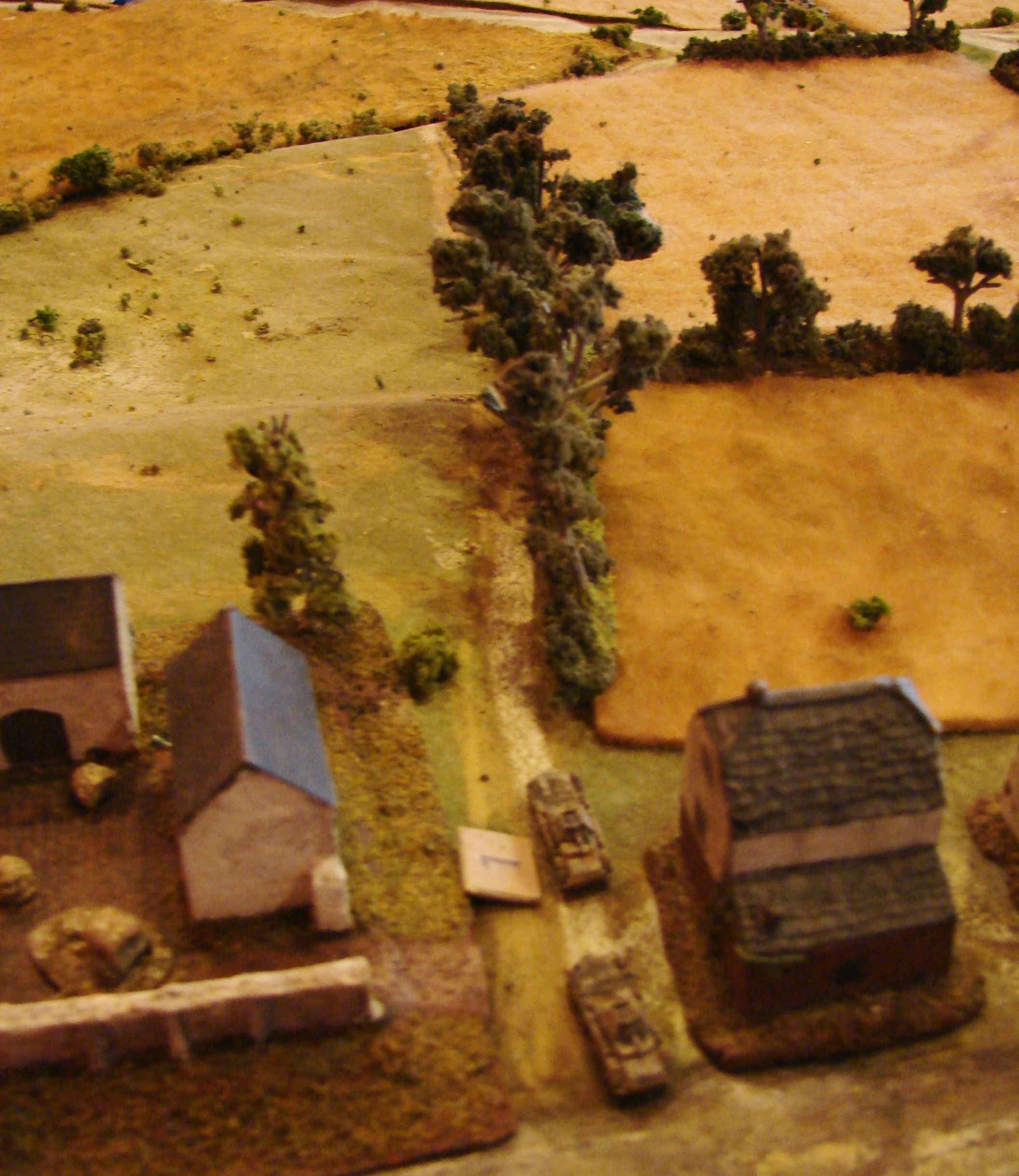 Retreat of the Heavies The 234/1s ran smack into the Humber A/C at the intersection in the center of the table. They came off worse as all four of the Humber a/c had a chance to shoot. The Germans lost one of the 234/1s and had another take a Shock point in the uneven exchange. Nice feature is the ability to run fast in reverse.