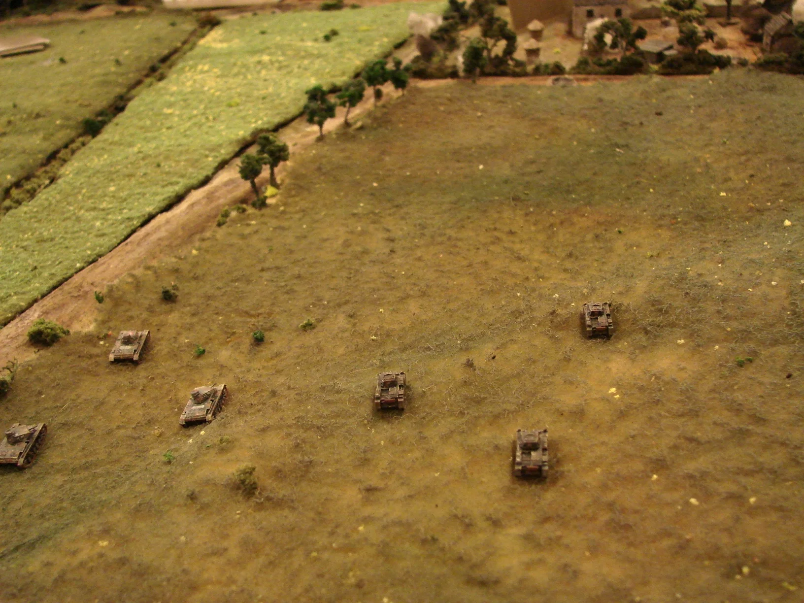 Moving toward the farm Zugs of Pz IIIs and Pz IIs hope to get close enough to engage the defenders before the shock comes off.
