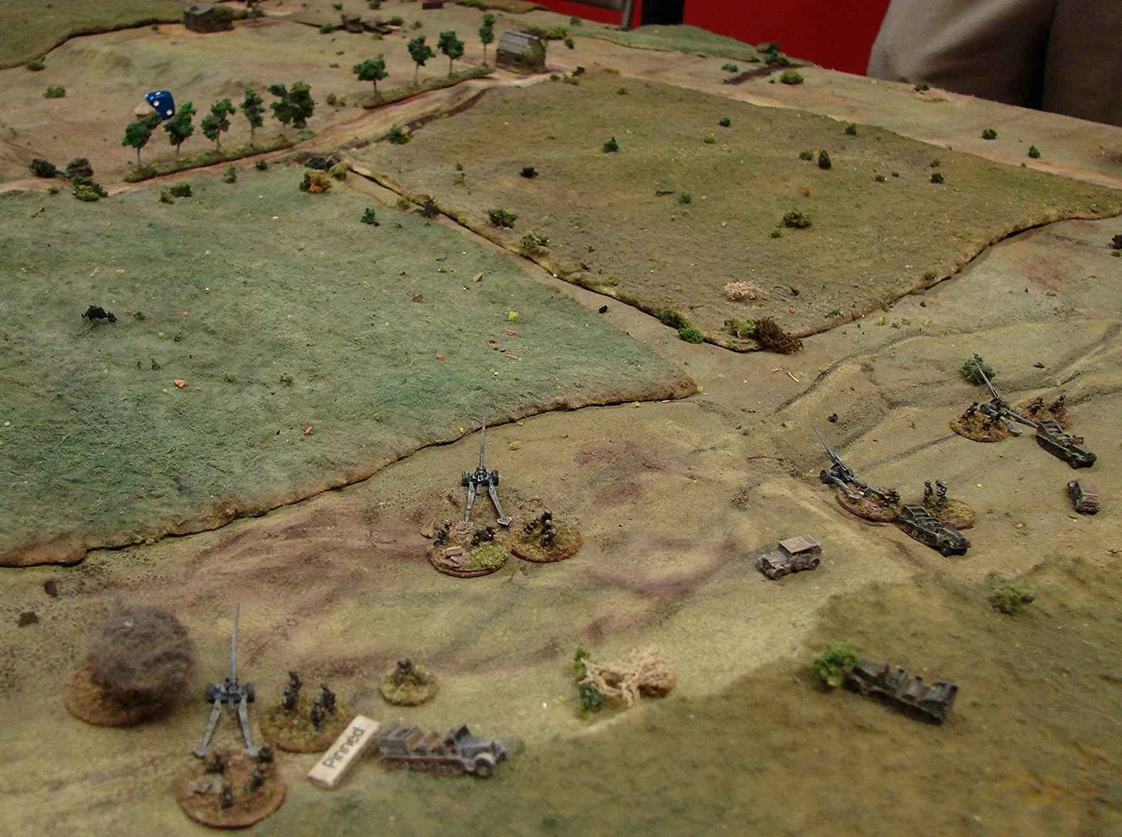9 Batterie under fire Only two of the 100mm guns had a good line of sight on the approach road. Brian decided to move the other two guns up to the road that the Red tanks were using. The race is on.