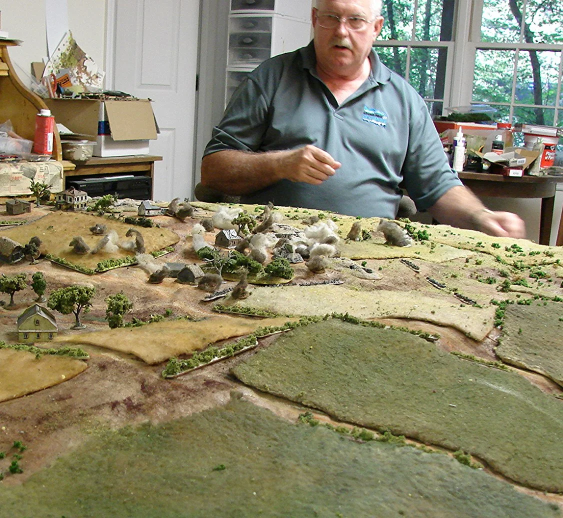 Artillery coming down on the village Rick and I as the Soviets had two pregame stonks. So he elected to put them around the village area. Martin rolls for casualties. I think he had quite a bit of shock on his units and a Sdkfz 250 was immobilized. Most of his units were out of the beaten area.