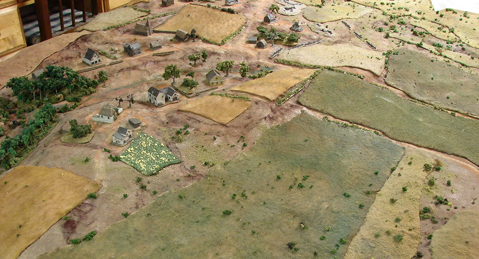 Rolling Terrain This game was put together pretty quickly once I found out what the Florida players wanted to see. Rick had ten M3 Grants and he likes Russian Front, so I thought I'd do a nice little Kursk game. That patch of yellow and green is a sunflower field per a request from Pam.