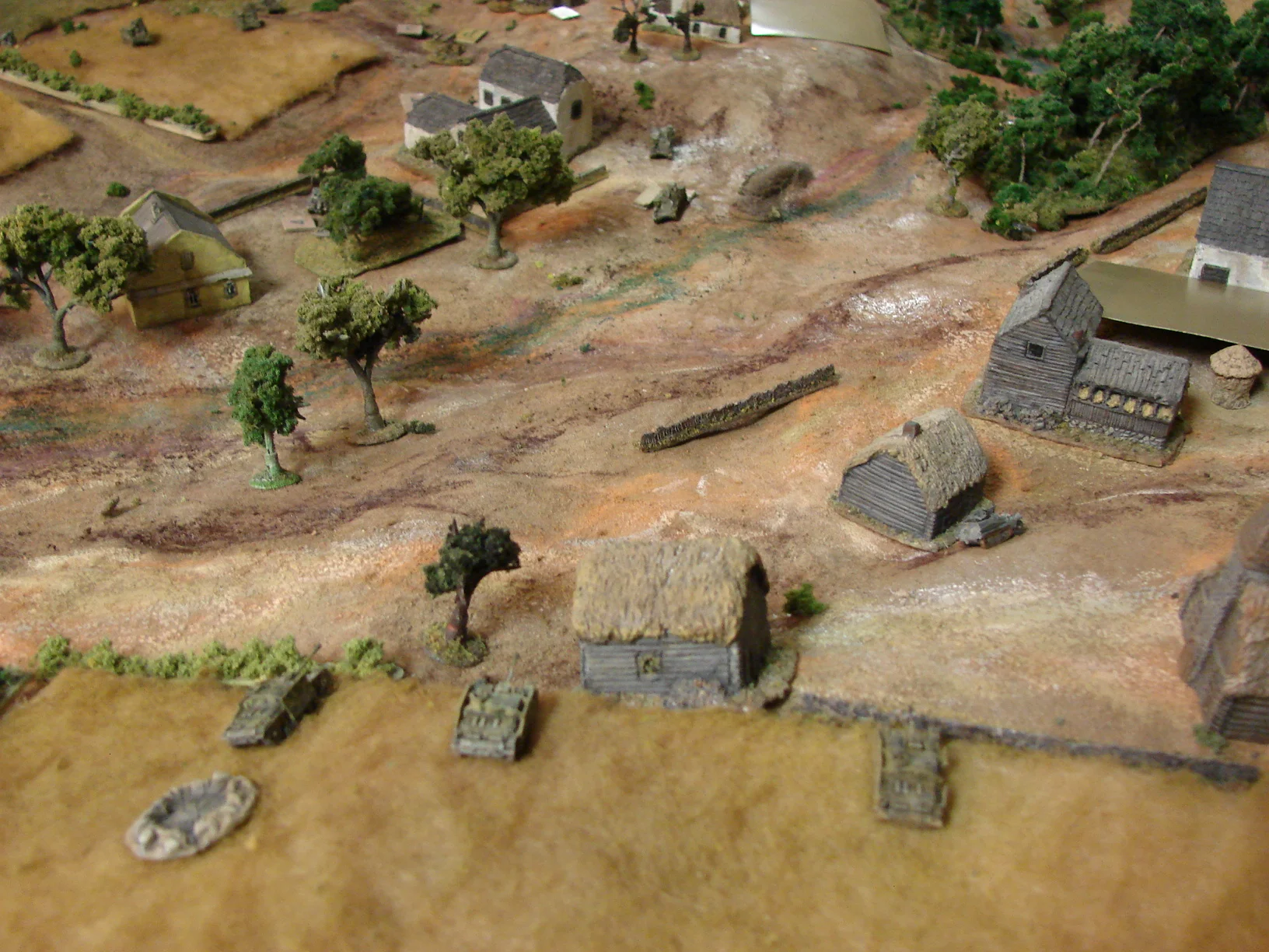 And now the StuGs open up Martin's battery of Stugs had moved to the right to overlook the lower parts of the village. And when the lead unit of Grants appeared, they hammered them.