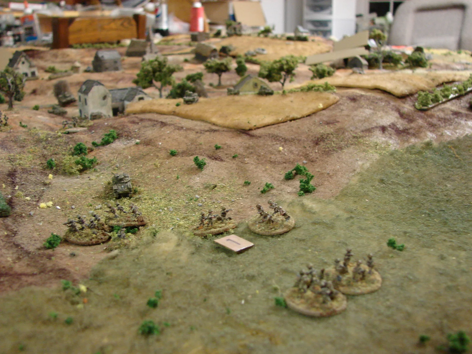 Company CO leads the rest of the infantry into the fight The platoon that was shot up by the halftracks earlier and lost a platoon CO is shepherded into the village by the Company CO.
