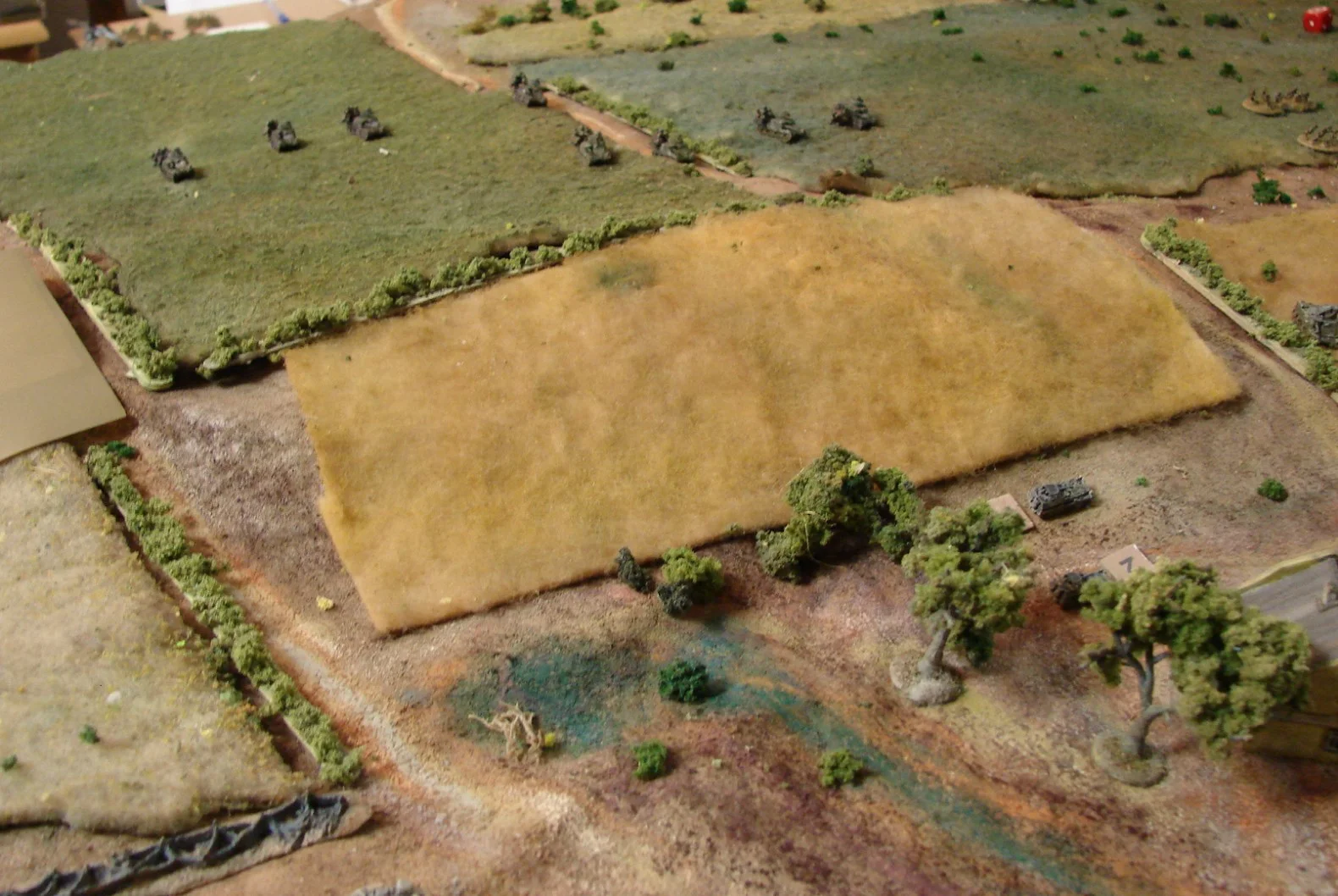Second company of Russians finally arrives And I finally get on the table with my company. I rolled ahead of time to see how many turns of the "Blank" card it would be before I came on the table. Only two turns were required, but alas that took awhile. There is a dummy German blind to the left and a slight ridge between my company and the 250/9s.