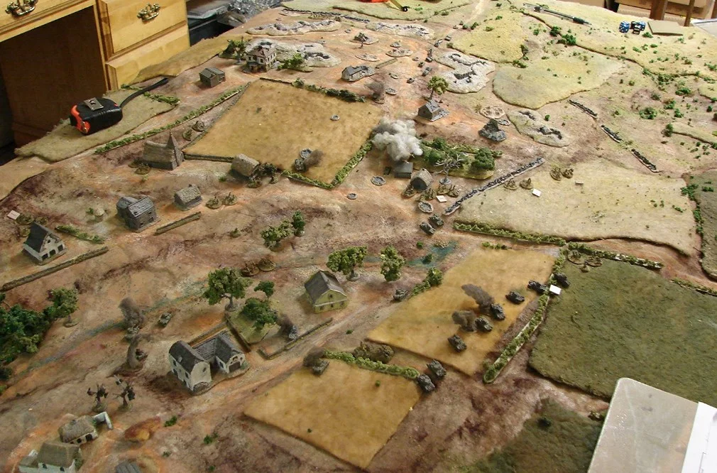 Game end positions So the final score. Soviets loses: Rick had four M3s KO'ed, including both platoon COs; eleven infantry casualties and one platoon CO KIA. I lost two M3s to explosions and two more had to be abandoned. The Company CO was KO'ed along with a platoon CO tank. And five grunts and a platoon CO were casualties. Martin's Germans lost their StuG battery CO and three grenadiers in the pre-game stonk; one 250/9 20mm halftrack; one 250/10 half-track with the 37mm PaK. Two other halftracks were damaged in the artillery barrage. The Russians did take the village and their former positions, so I would say a victory for the Reds. Another really fun game of IABSM.