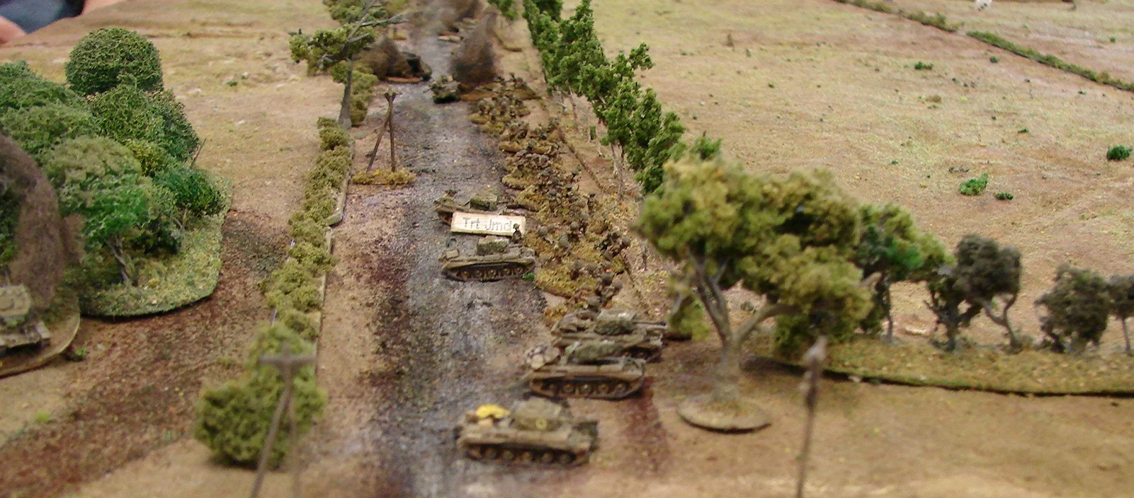 All hands facing to the left Two platoons lining the roadside ditch and three troops of Cromwells face towards the Germans. Two more Cromwells are off picture at the bottom.