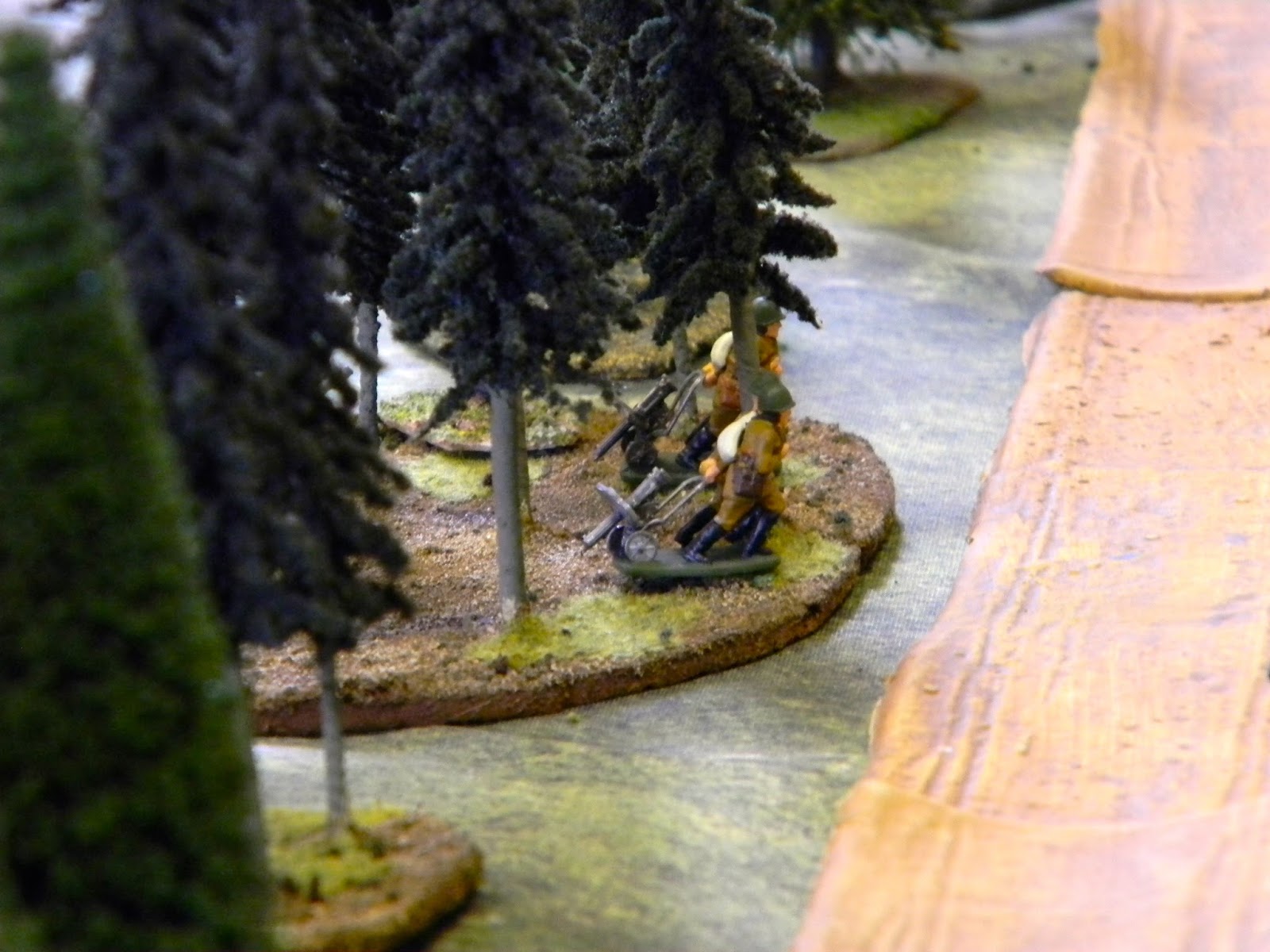  As Soviet machine gunners drag their pieces into position amongst the trees. 
