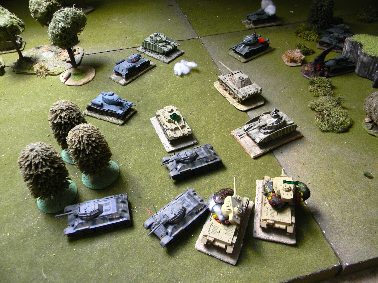 And it turns out to be the German tank CO who crashes through the trees and engages the T34s