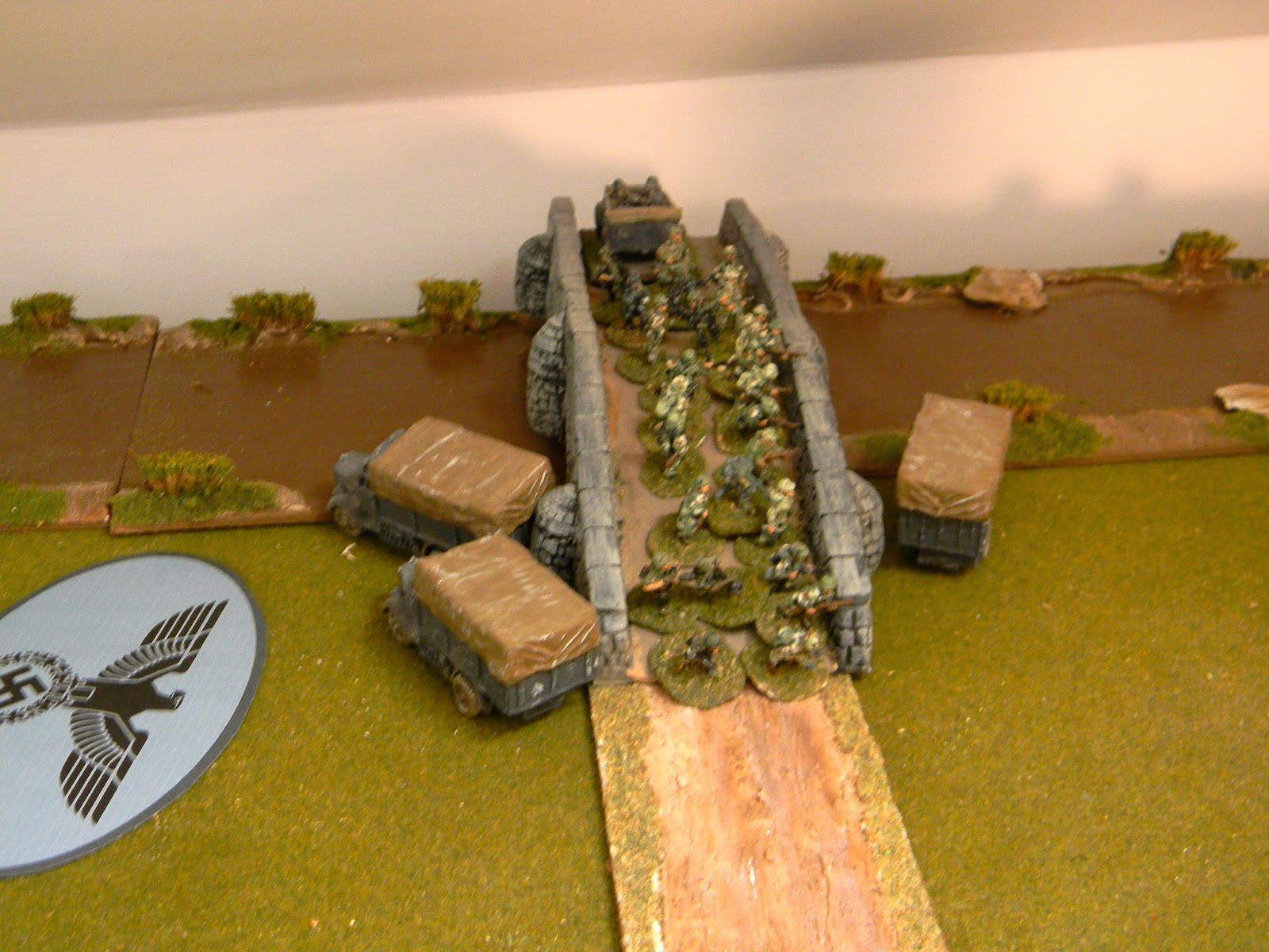 The Blind by the bridge turned out to be Lt. Warsteiner's 30th Panzergrenadiers in trucks and they swiftly occupied the bridge: both sides' objective.