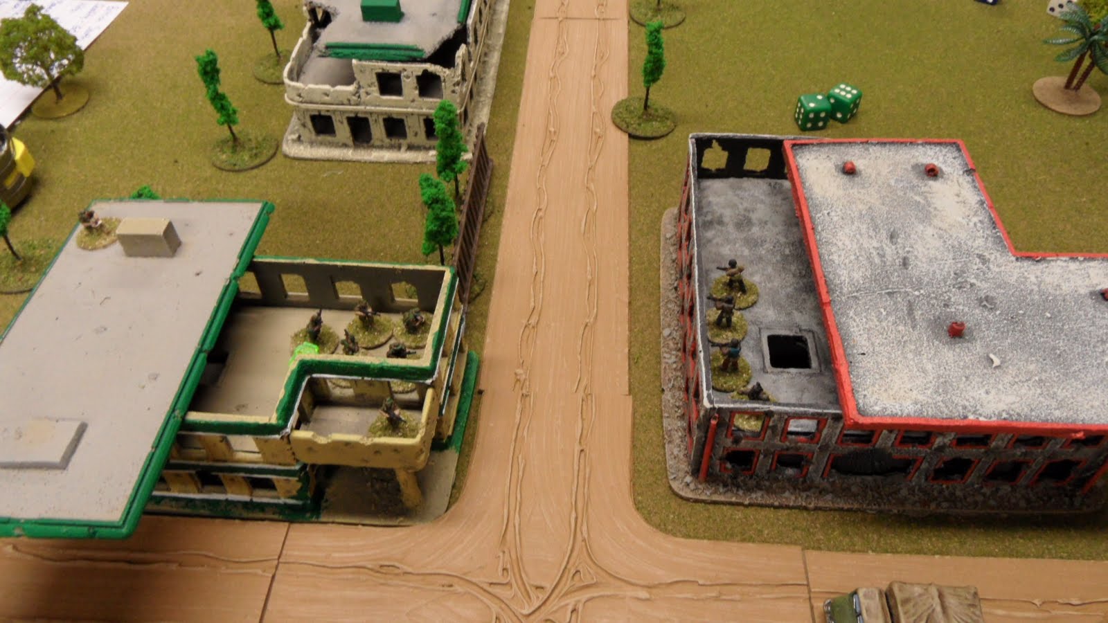 the rebels losing the firefight across the street. note the dreaded sniper on the police station balcony