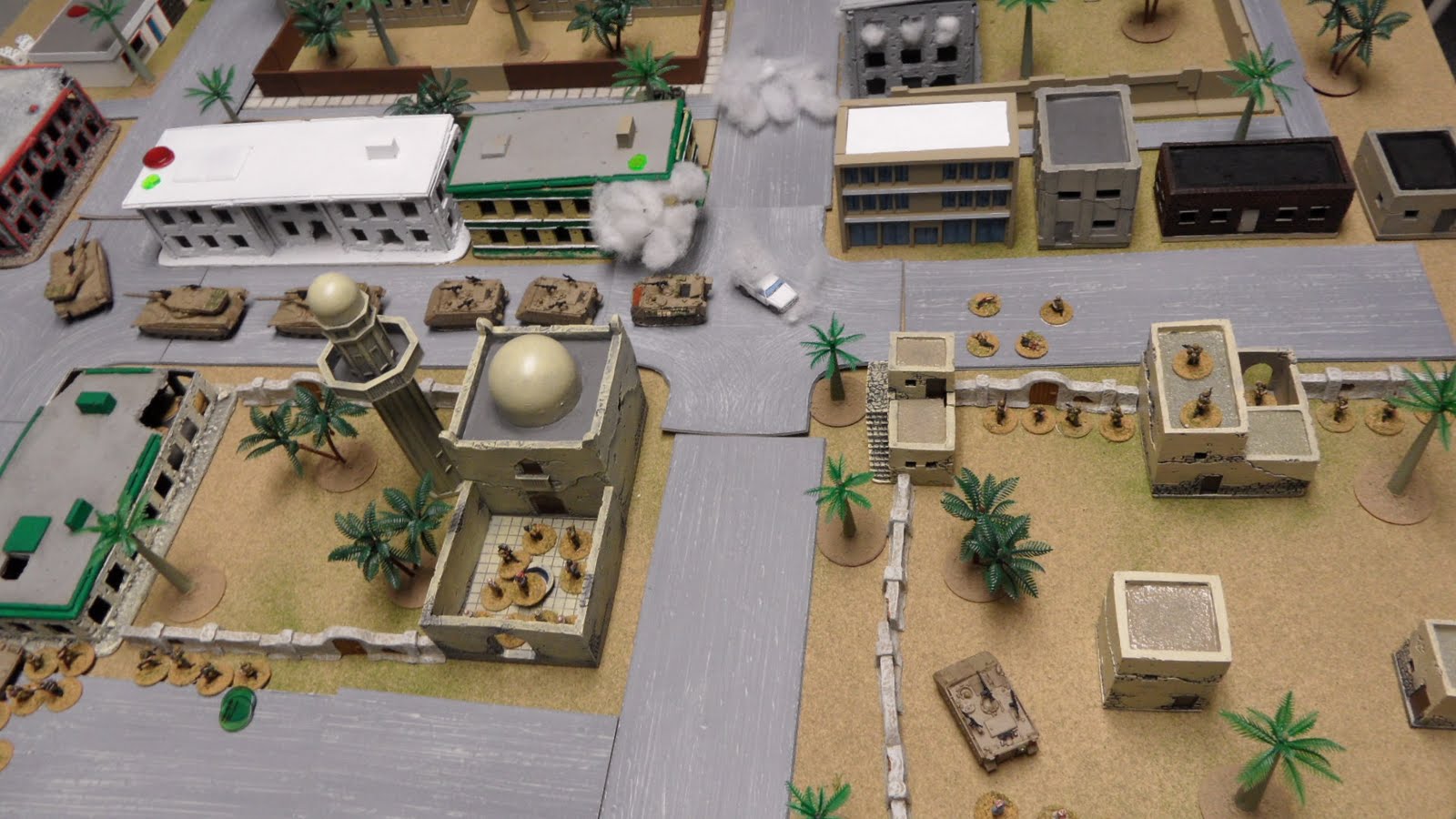 The Merkava Platoon makes its way past the torn-up intersection, looking for the RR...