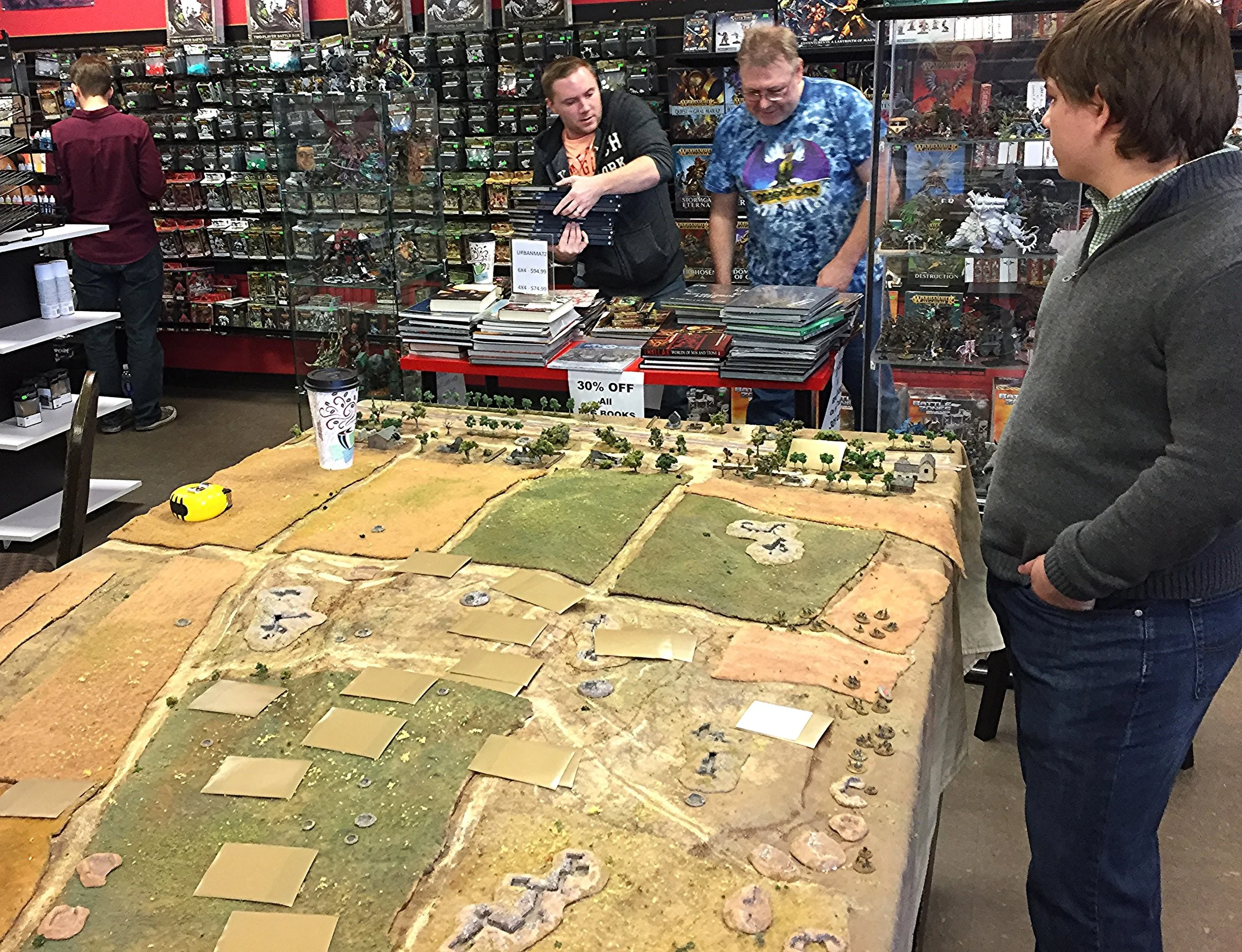 David (Gigabites owner) and Chris S discuss discounted RPG books while Jacob awaits the Soviet onslaught.