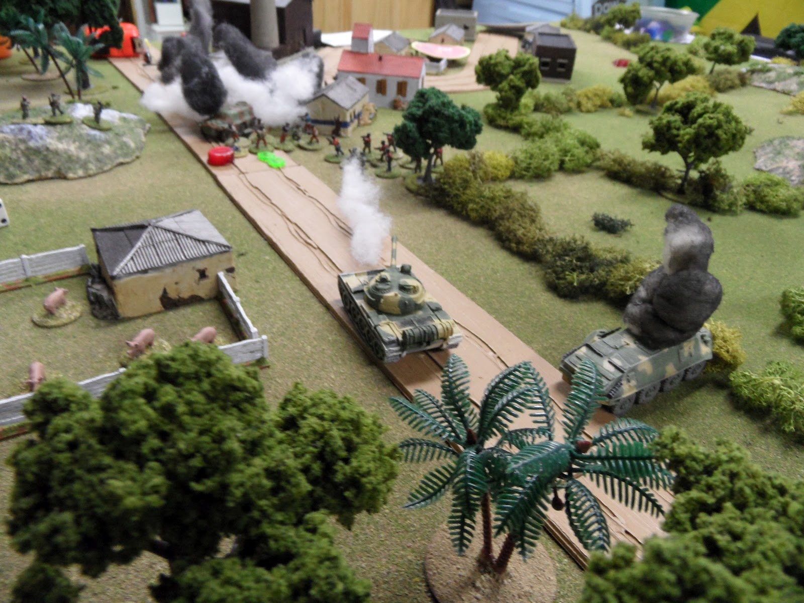  The rebels vainly fire an RPG at the T-55, and are subjected to return fire for their efforts. 