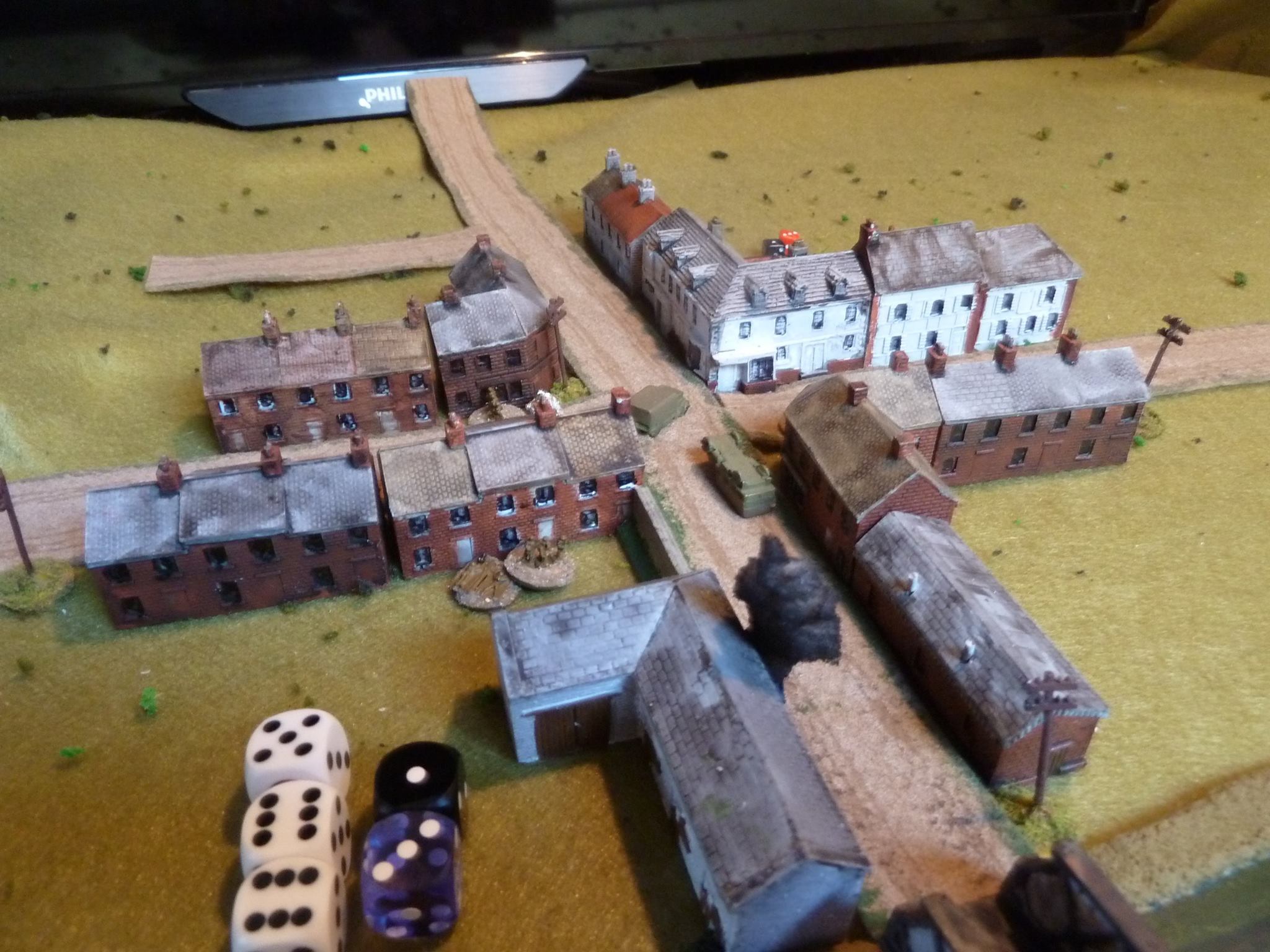 A Boys ATR shot rings out from the white corner house hitting the lead Pz I and a great roll means the end of Panzer Leader 1!