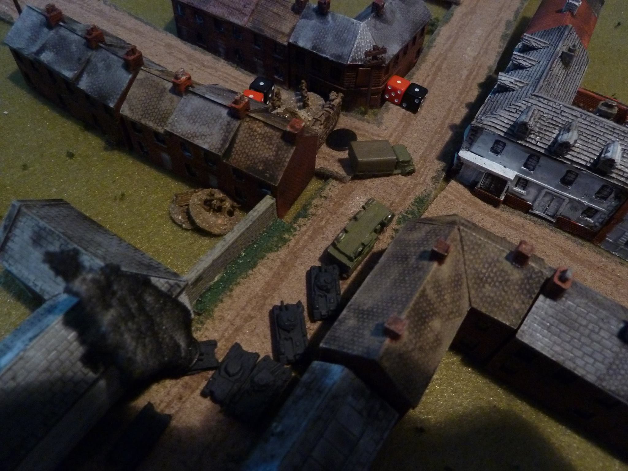 A little later: the lead Pz II starts ripping up the barricade, the ATR man dies and things look desperate for the Brits!