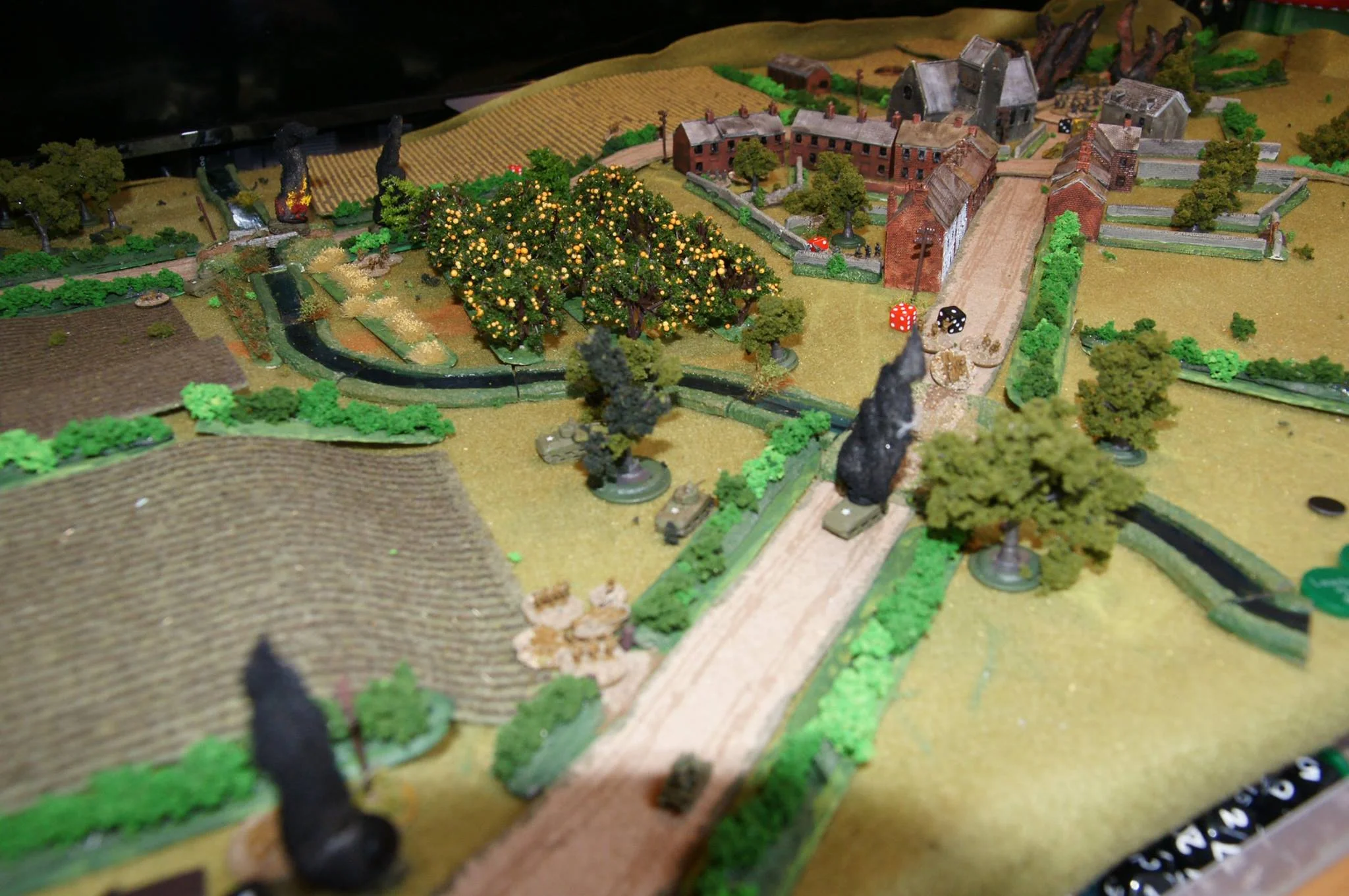 A shot from the western bridge showing the Panther causing chaos. It has just finished off the second Firefly (blur of smoke at bottom left); and the section that dashed over the bridge got hammered by the German squad covering it. Should really have used more smoke first! Again, the attack has just been ground down. Good game, but I really need to work on my combined arms attack tactics: Major Tree fails again :(