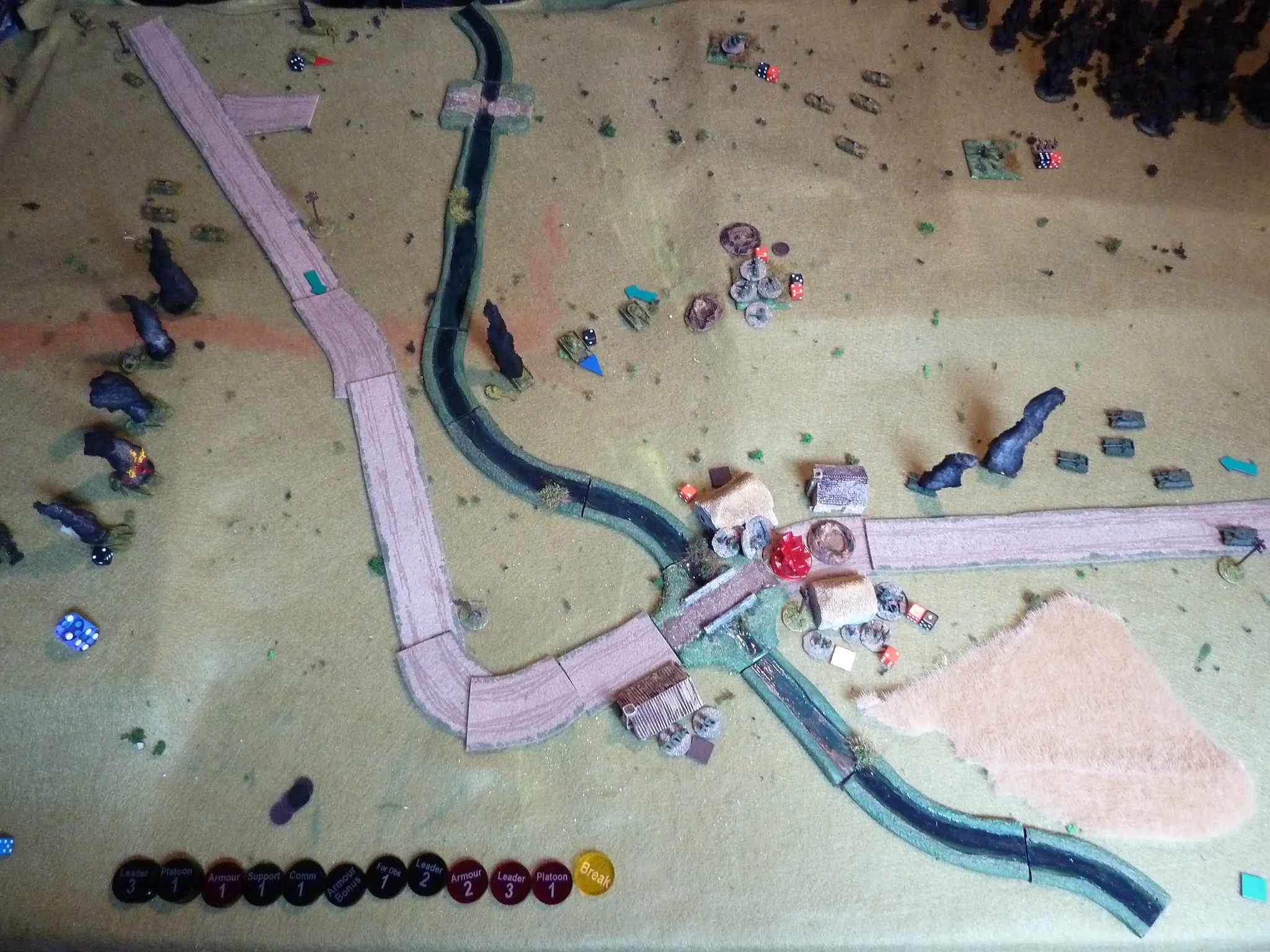 The remains of the first Panzer IV platoon crawls around the hill and pops a couple of the Su-76s, but the remaining ATG in the hamlet is re-positioned to take shots and gets hits. Down to one undamaged Panzer IV...things are not going well.