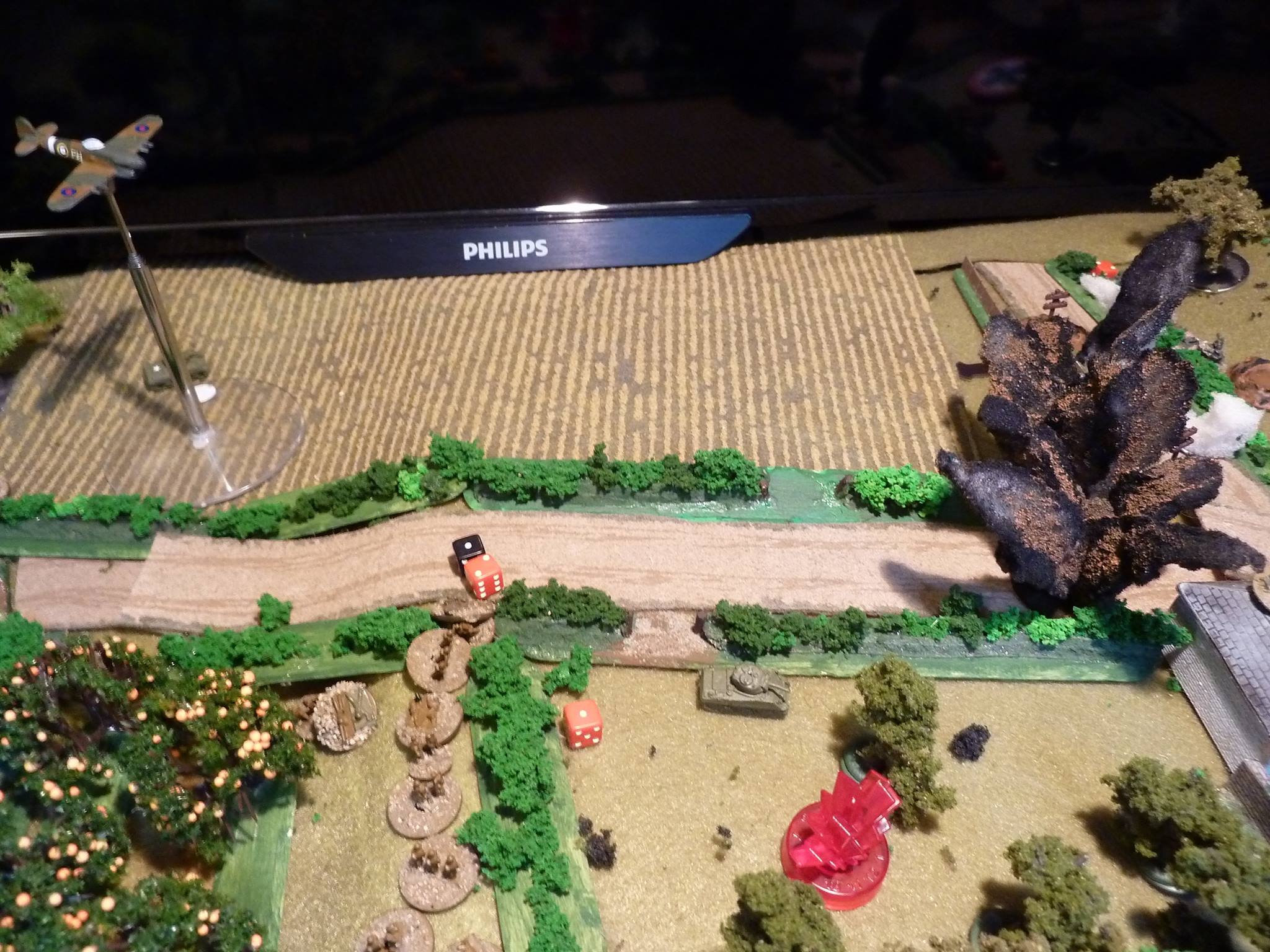  The Canadians in the field flee across the hedge and the road. They take fire from the Germans in the barn and the remains manage to get into the orchard.&nbsp;  A Sherman moves forward toward the barn and a shot from a 'faust misses.  Luckily, the 