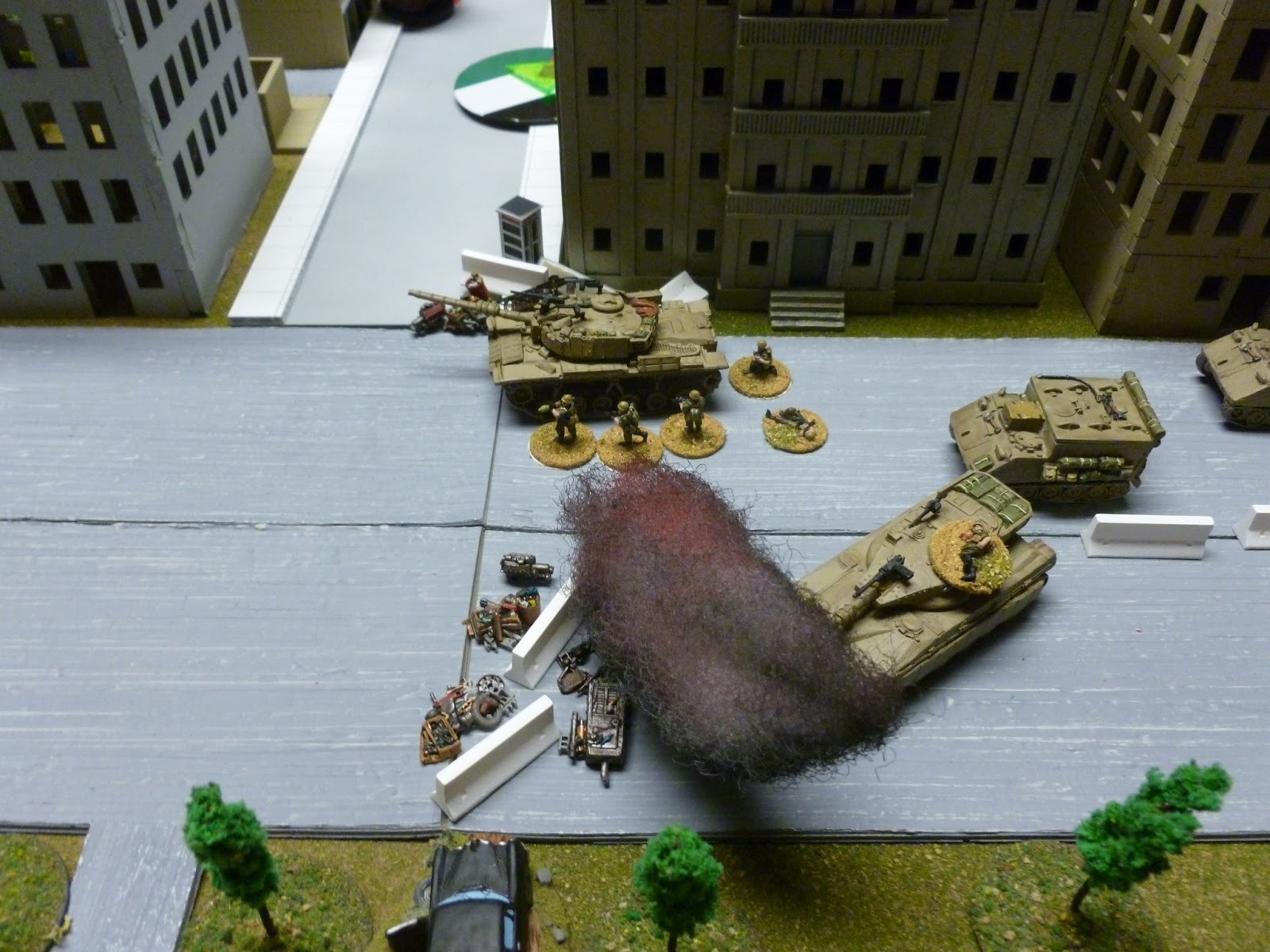  The Magach continues to fire on the T-34, guarded against RPGs by a squad of grunts. 