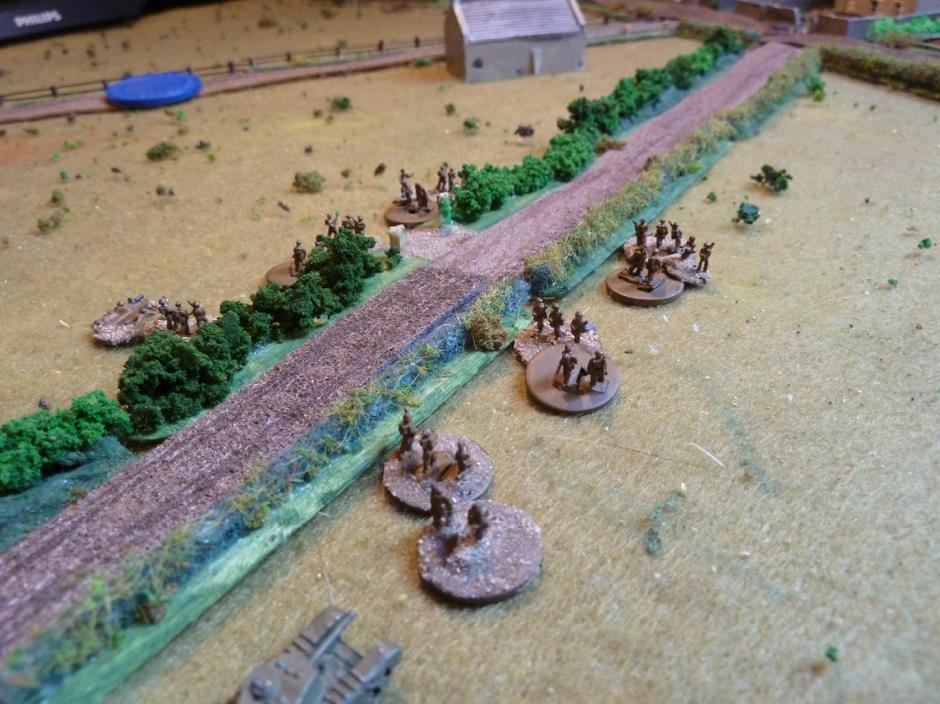  While the British #2 &amp; 3 platoons move forward, the Germans are holding fire until the British squaddies are within effective range.     There is a Churchill in support on the right and another two on the track moving very slowly!     A further 
