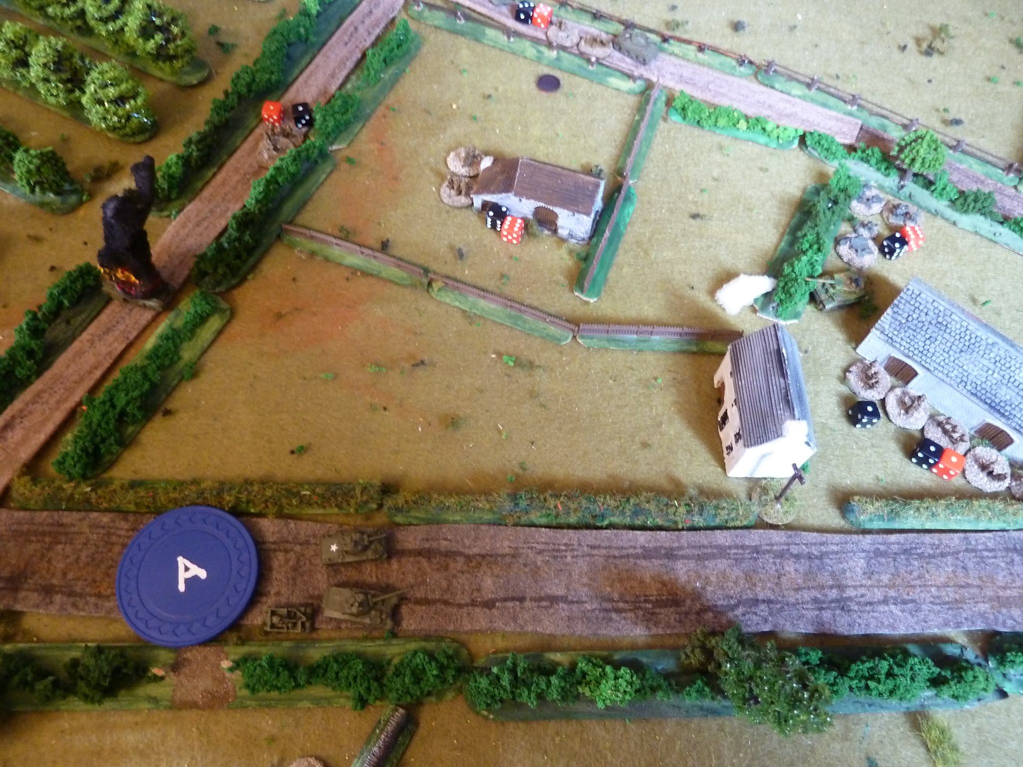  The sections from No 3 platoon ignore the Tiger close by and dash across the stables, chasing the fleeing German squad. 