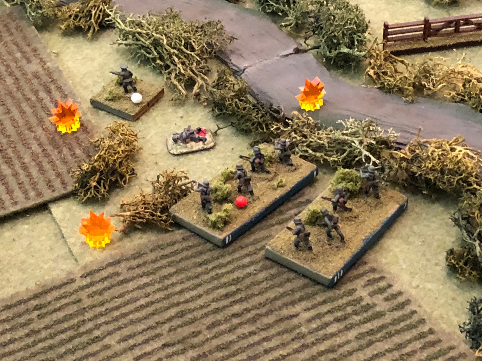  And the French fusillade is furious, knocking out SSgt Aust's 1st Squad and suppressing Lt Klugmann and Sgt Kamphaus' 2nd Squad (red bead, Lt Klugmann has a white bead but it should be red, too, I just screwed up).   