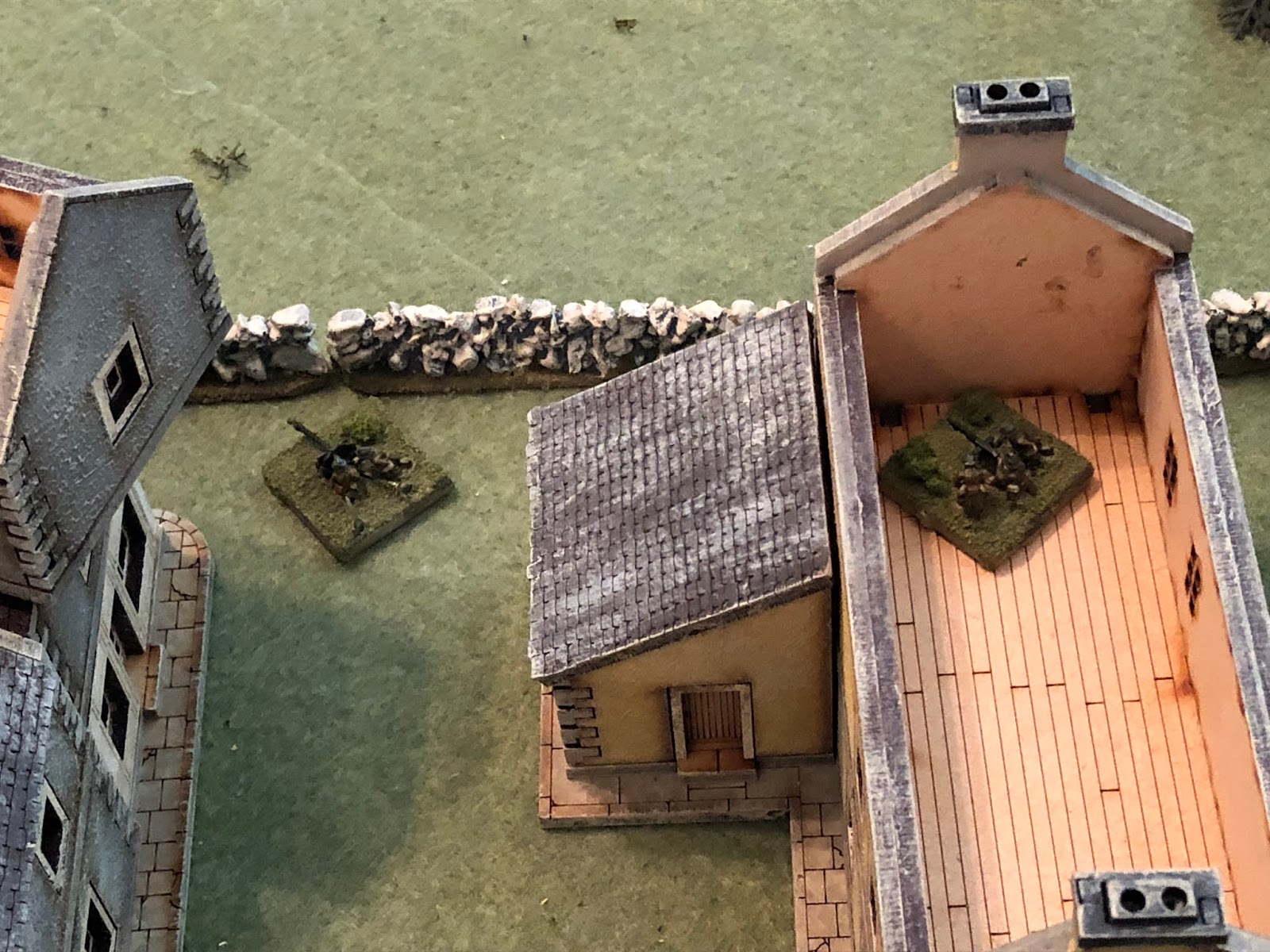  With his 2nd Platoon temporarily hors de combat, Major Renaut commits his Weapons Platoon: the tripod-mounted Hotchkiss on the 2nd floor in the far south (2nd Platoon is in the building at bottom left), and the 25mm anti-tank gun at ground level, be