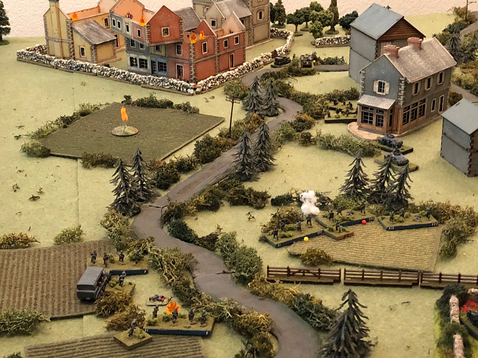  While Sgt Lehmkuh'ls squad (bottom left) fires on the enemy machine gun position (top left, in yellow building). 