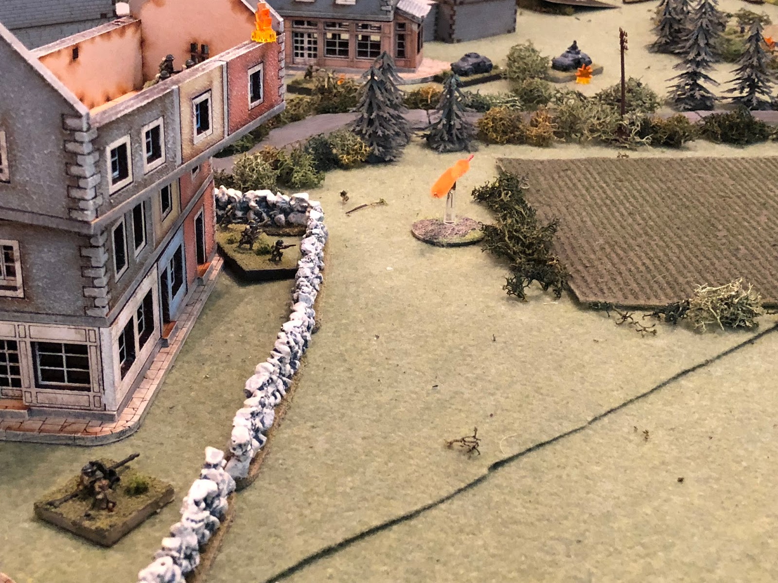  And then the enemy ATG (bottom left, with the French 2nd Platoon in the building at left and at ground level, above them) gets into the fight.&nbsp; The enemy gun captain cranks the weapon over, lines up on Lt Weidner's armored car (top right), and 