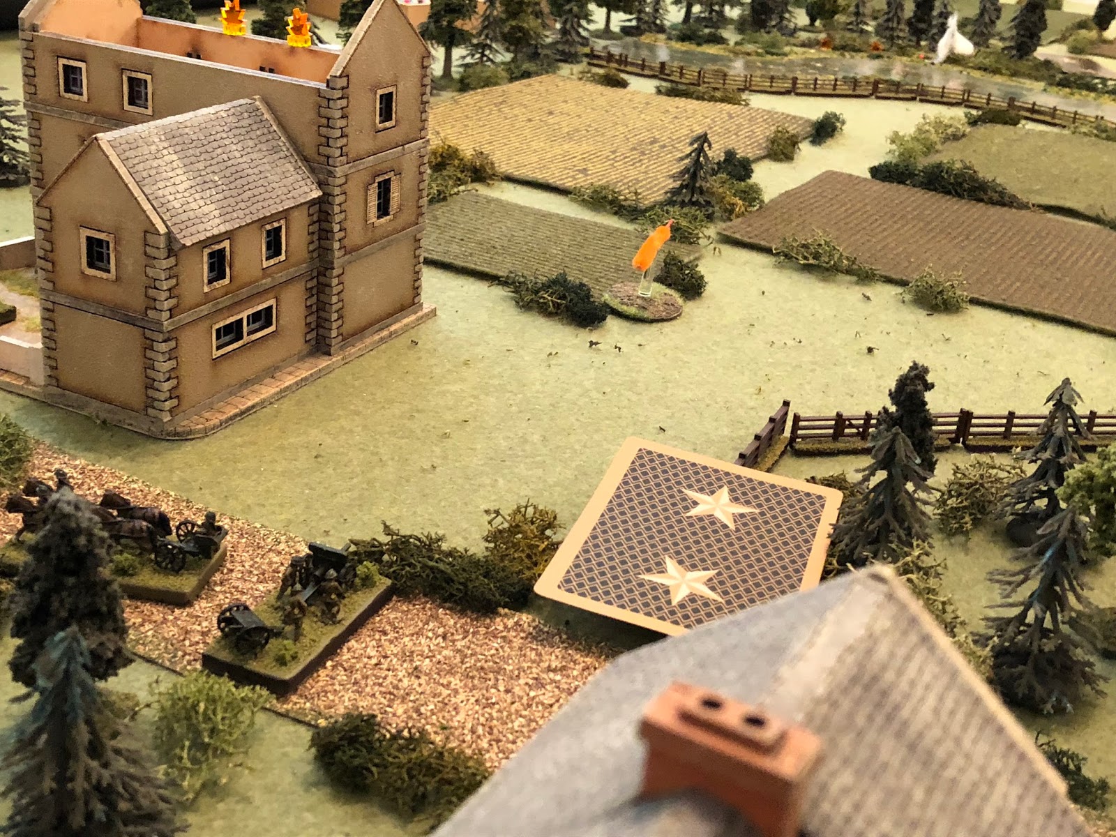  Back at the farm, the French 75mm (bottom left) goes into action, pounding the German Weapons Platoon in the northern treeline (top centre right). 