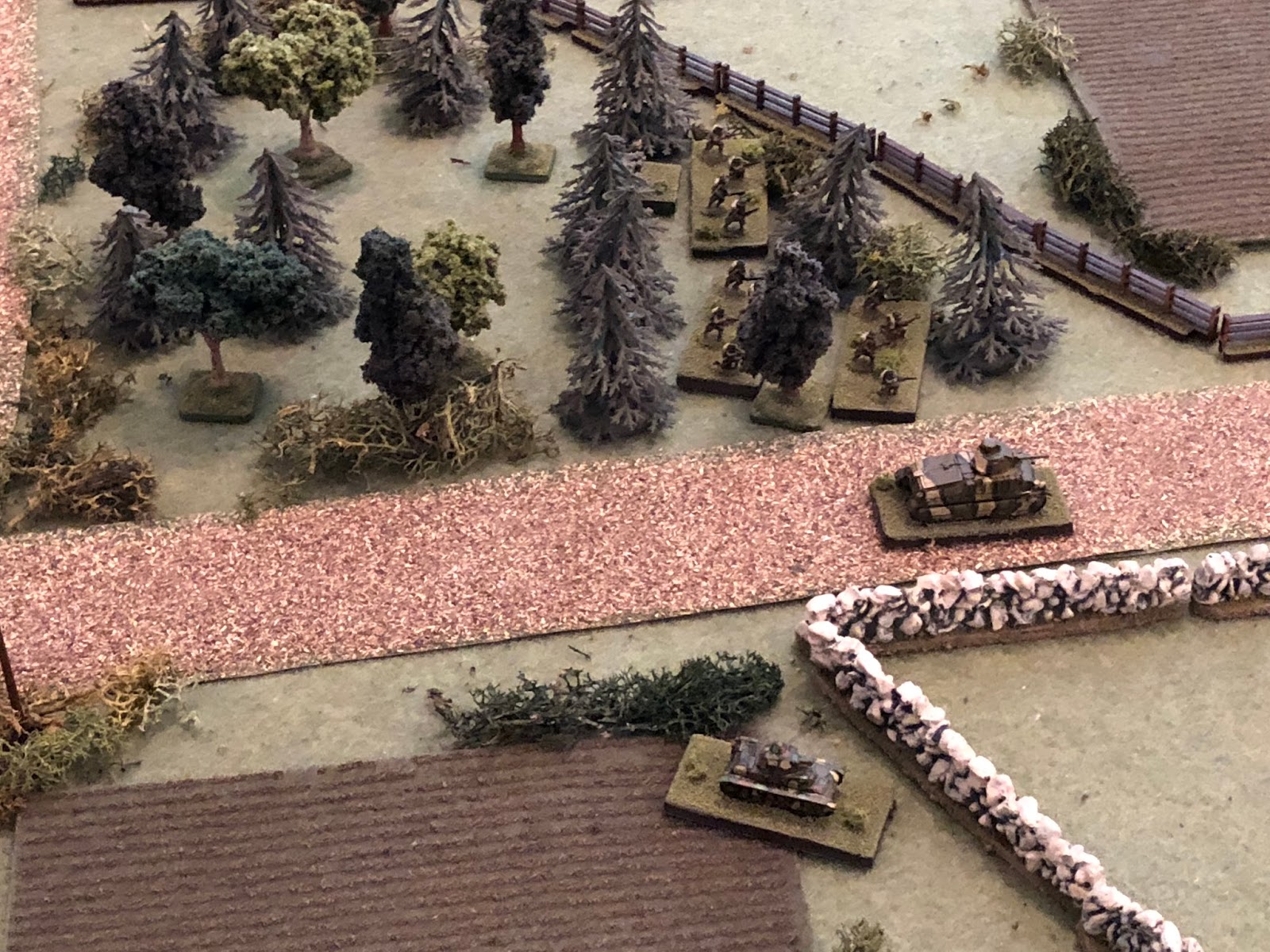  With both German tanks sheltering from the 75's fire, the southern Somua begins pushing east down main street (center right, with the H39 below it and 2nd Platoon above it, in the trees).  The boy is making his play, stuff is about to get interestin