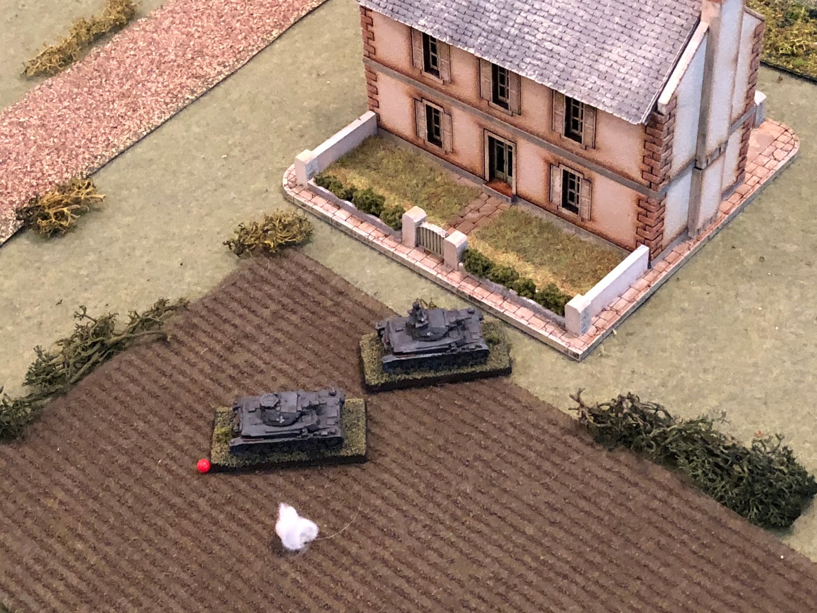  Sgt Graebner cautiously rolls his vehicle forward to see if he can acquirer a target, nosing past Sgt Kapps' tank, looking to spot the Frenchman firing on his partner.   