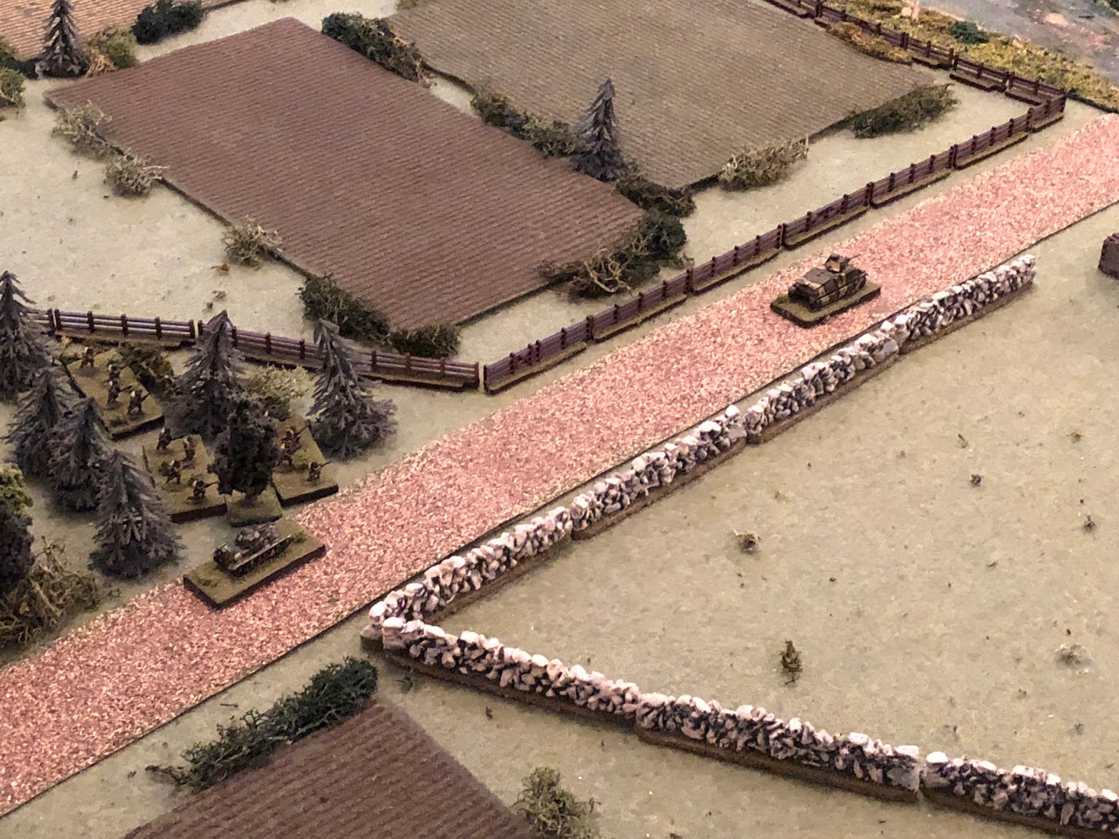  In the center, the H39 (bottom left) provides overwatch as the remaining Somua dashes east down main street (top right).&nbsp; The French 2nd Platoon, still sheltering in wood at the intersection (far left), look on&nbsp; as the tank skids to a halt