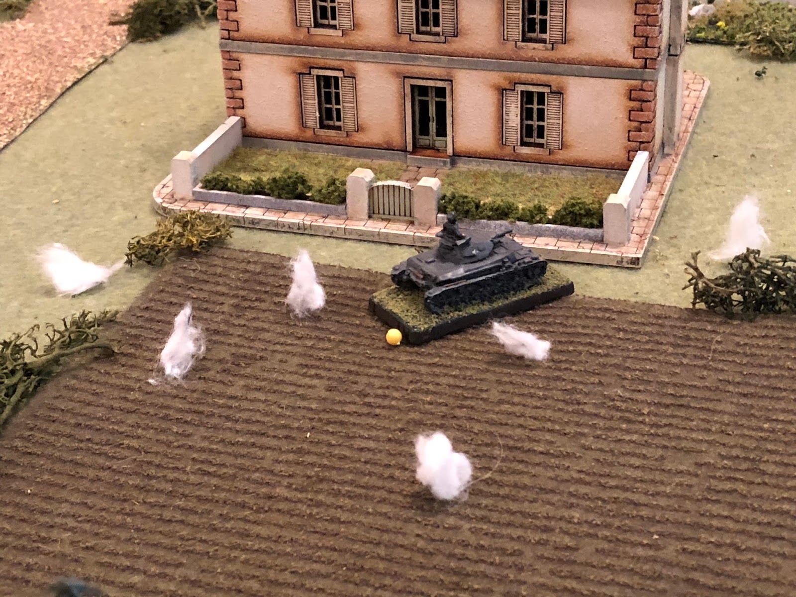  Sgt Graebner's Pz IV, pinning the crew behind Mlle Chevelle's house!  That is a significant development, the pin meaning Sgt Graebner can move his vehicle out to engage the French tanks on main street, but will more than likely not get the first sho
