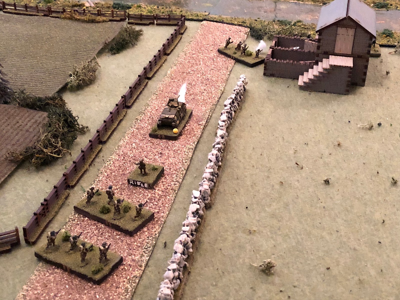 Back in the center on main street, the French Lieutenant for 2nd Platoon (center), orders his 1st Squad forward.&nbsp; The French infantrymen double-time up the street (top center), slowing once they reach the tollkeeper's house (which has the Germa