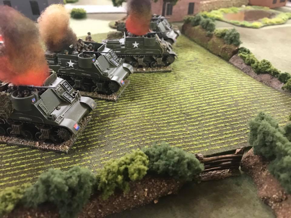 Kangeroo carriers ablaze. The infantry lost half their number.