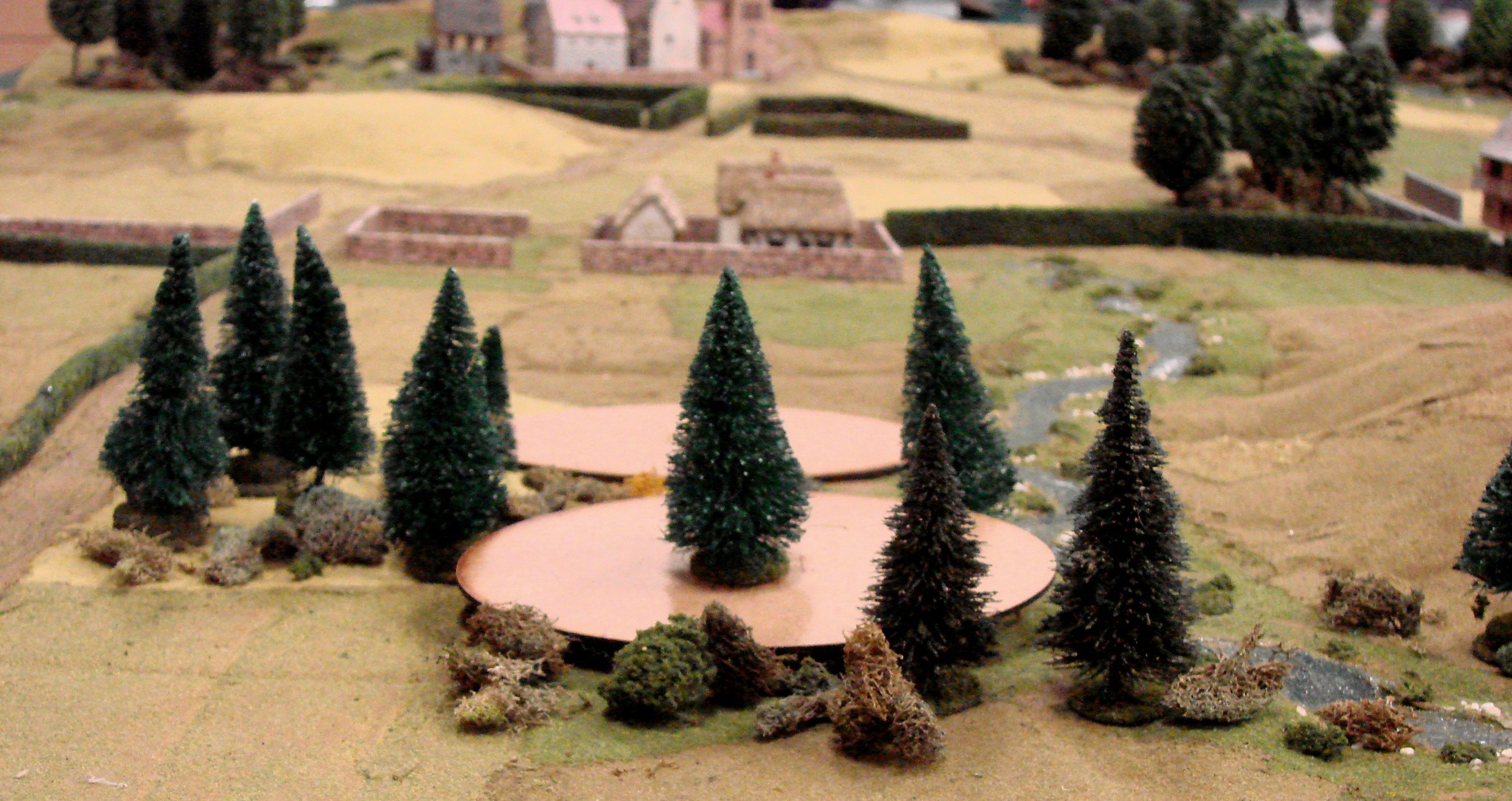 The Germans enter through the woods on blinds, one of the players cleverly disguising an approaching platoon by placing a tree on top of it. The Americans were not fooled.