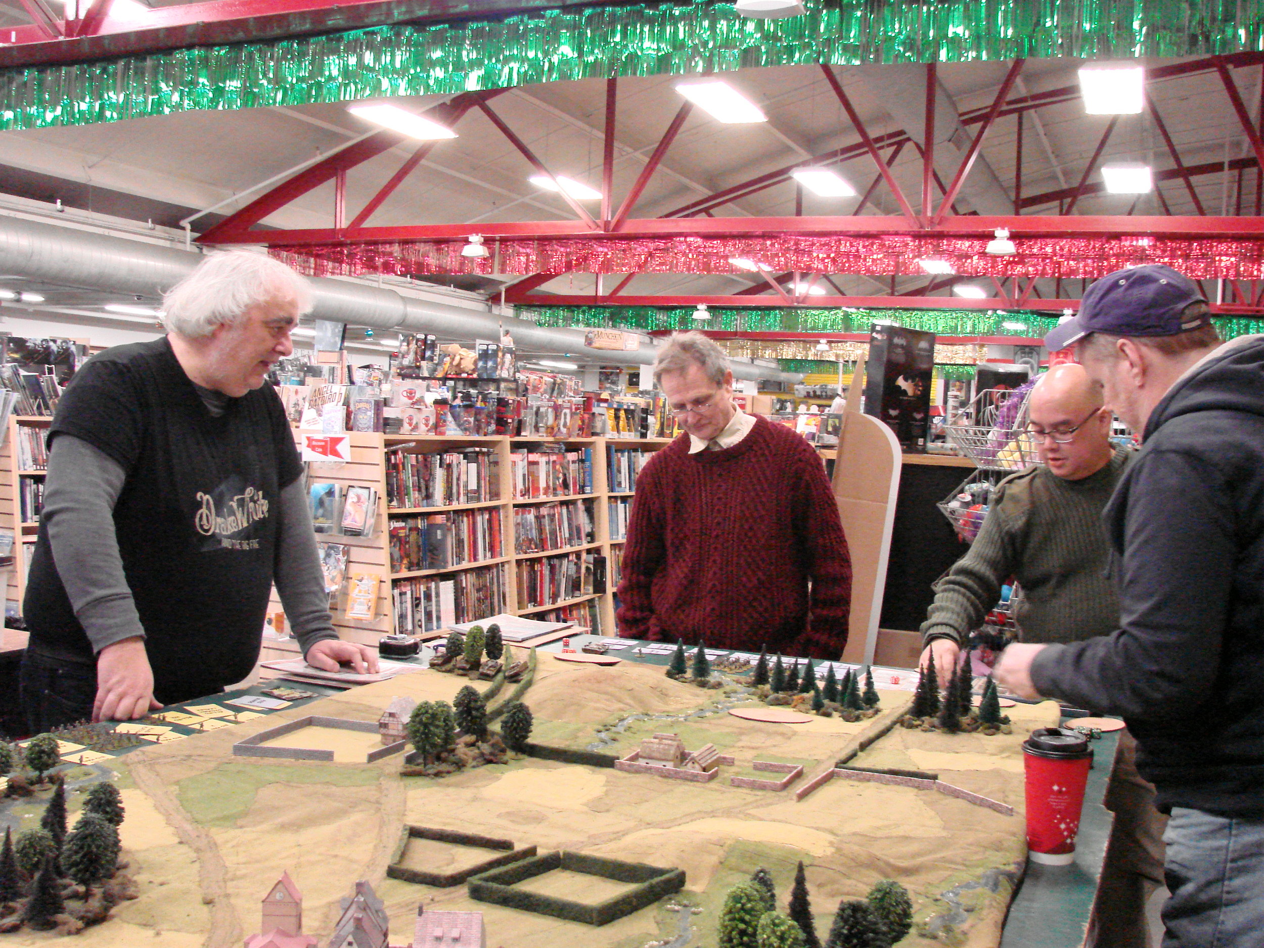 Mike Whitaker, guest gamemaster for the day, introduces the scenario to the German commanders.
