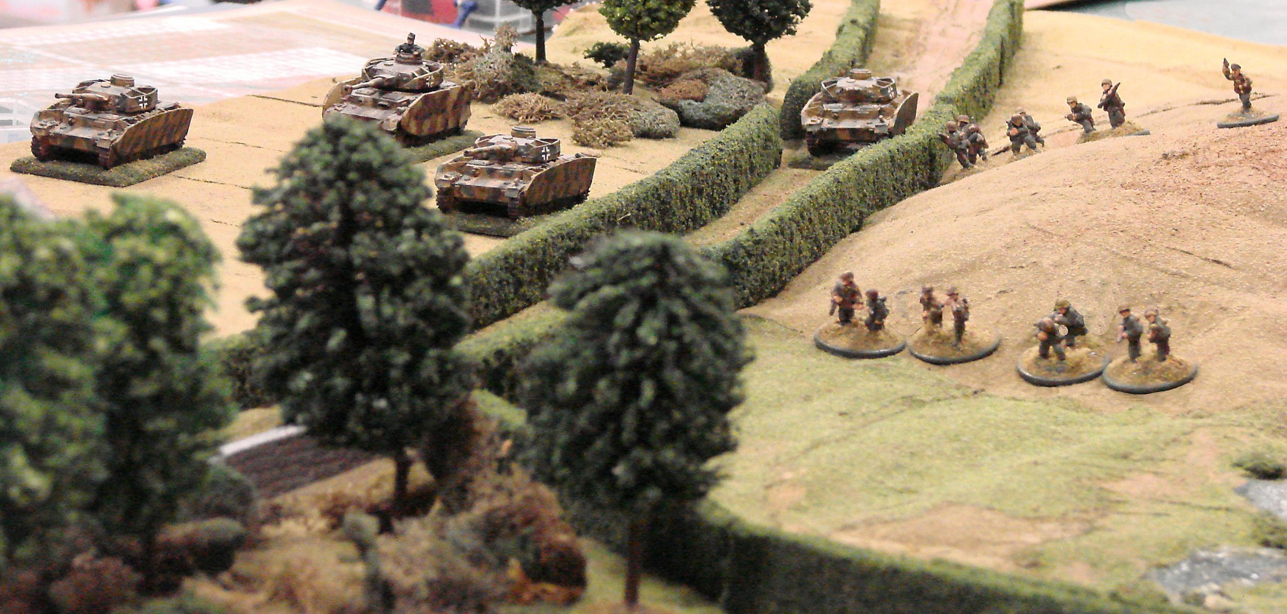 The advance on the chateau rolls forward while, unfortunately for the defenders, the battalion artillery is occupied with other targets.