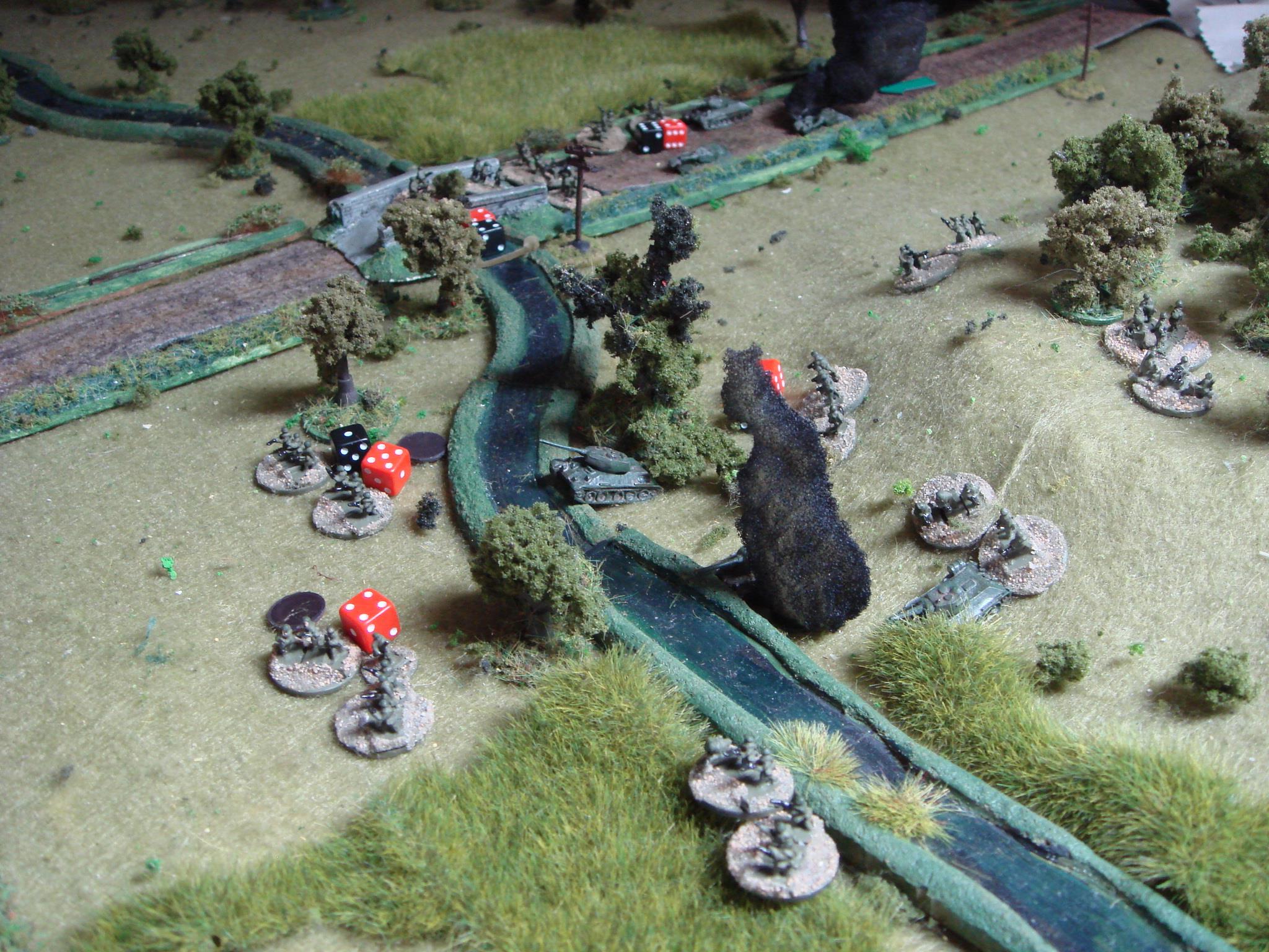  A close-up of the slaughter by the stream.  With half the Soviet force having taken heavy losses from the two MMGs, the Soviet company commander decides to call it a day. I'm sure the commissar will understand! 