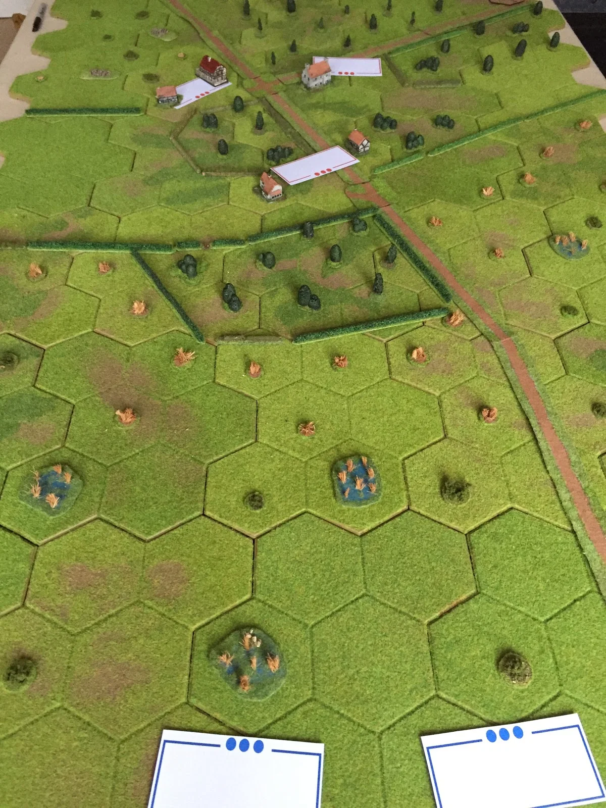 Long shot: British at bottom, Germans in village at top
