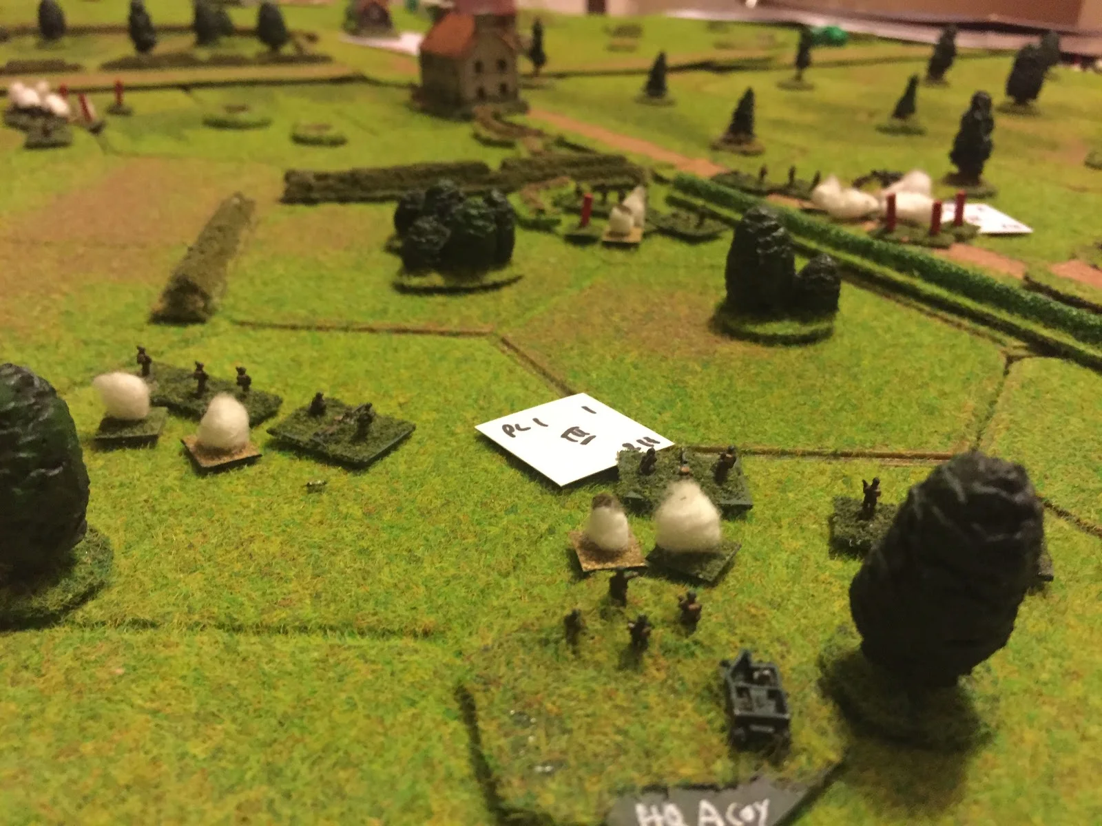 1 Platoon and 2/3 Sections recover in the Orchard whilst 3 Section/2 Platoon finishes their work, right