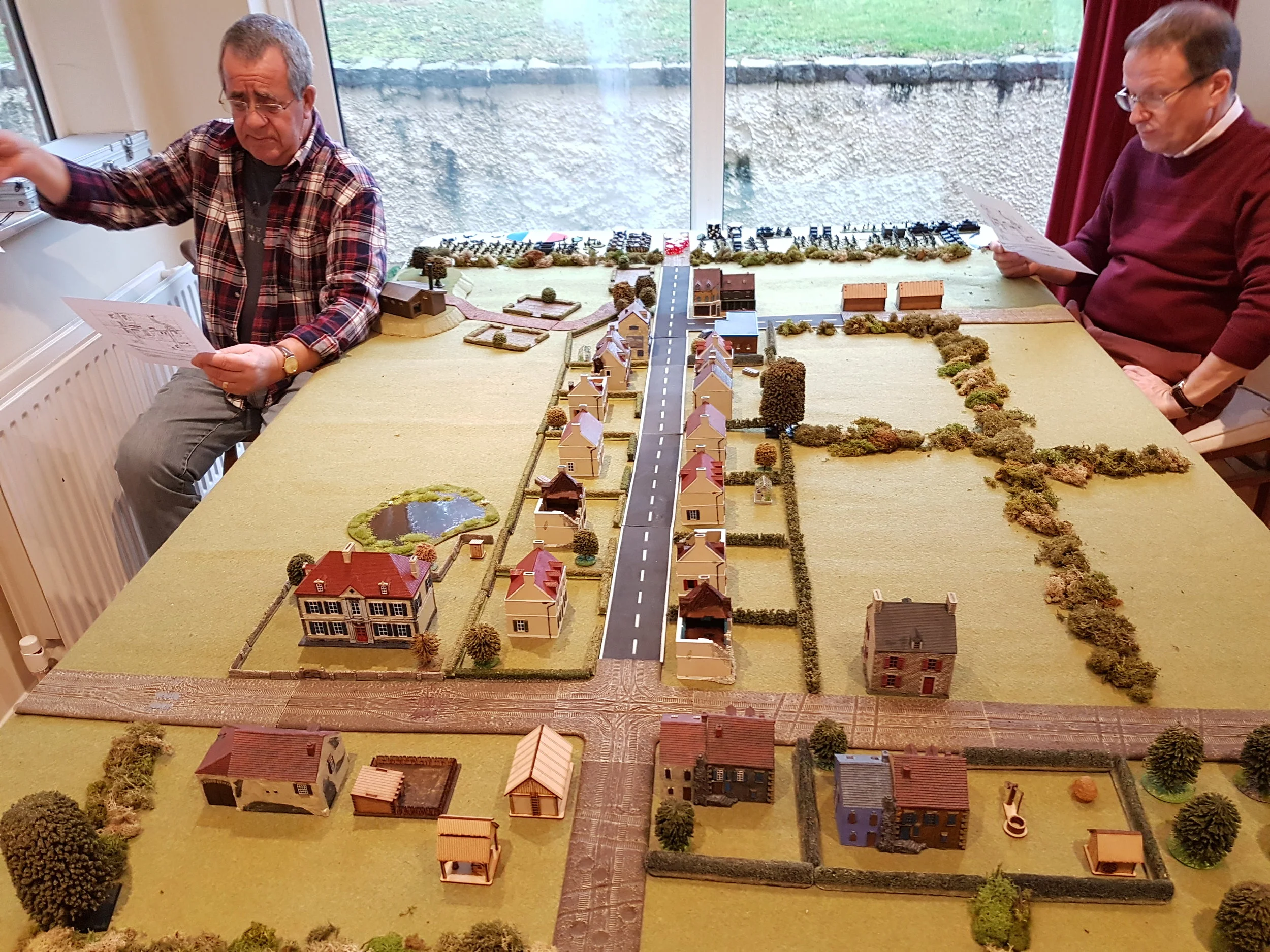 Capitaine Legume (on the left) and Major Lardich von Skinner (on the right) review their orders